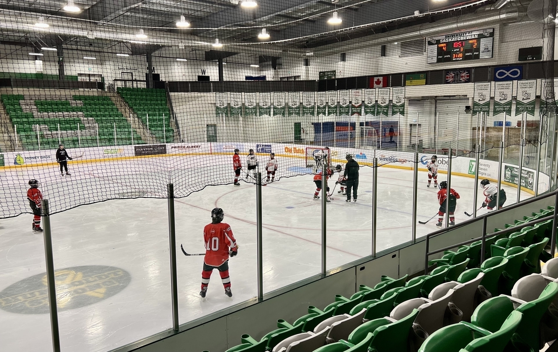 Photo of kids at a hockey practice in a hockey rink. &10;&10;