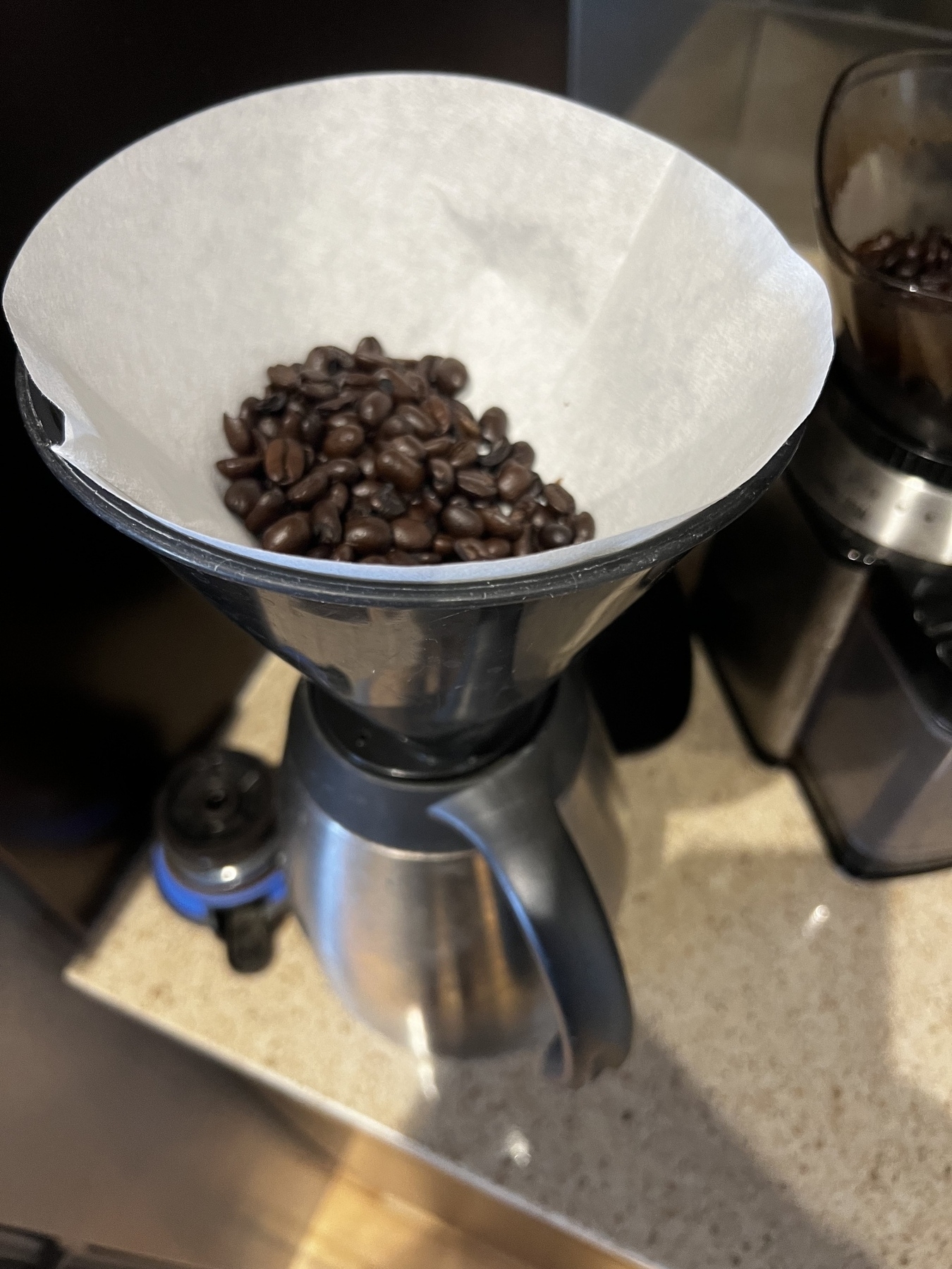 I poured beans into the coffee filter instead of into the grinder. 