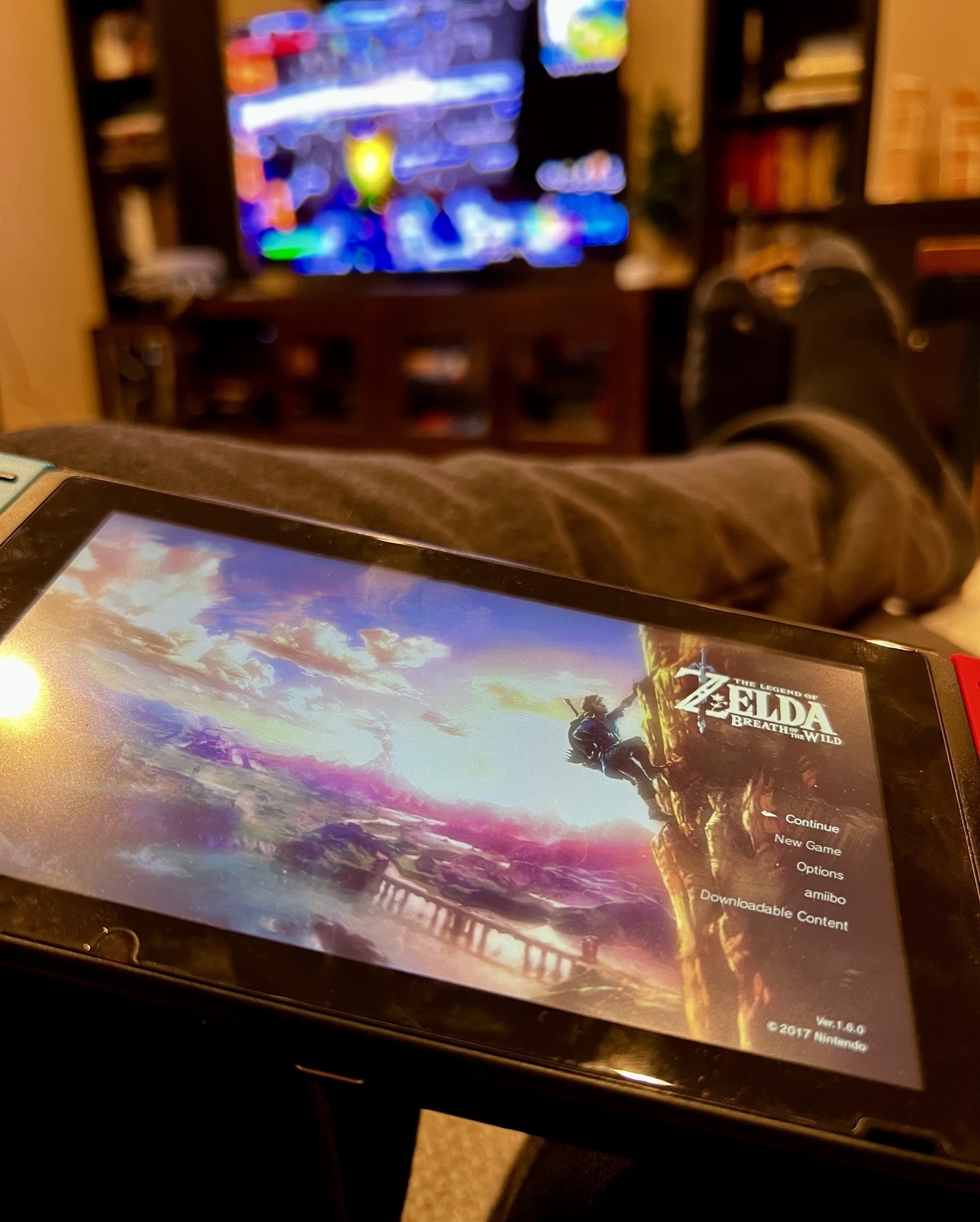 Photo of a Switch with Zelda: Breath of the Wild playing on it. 