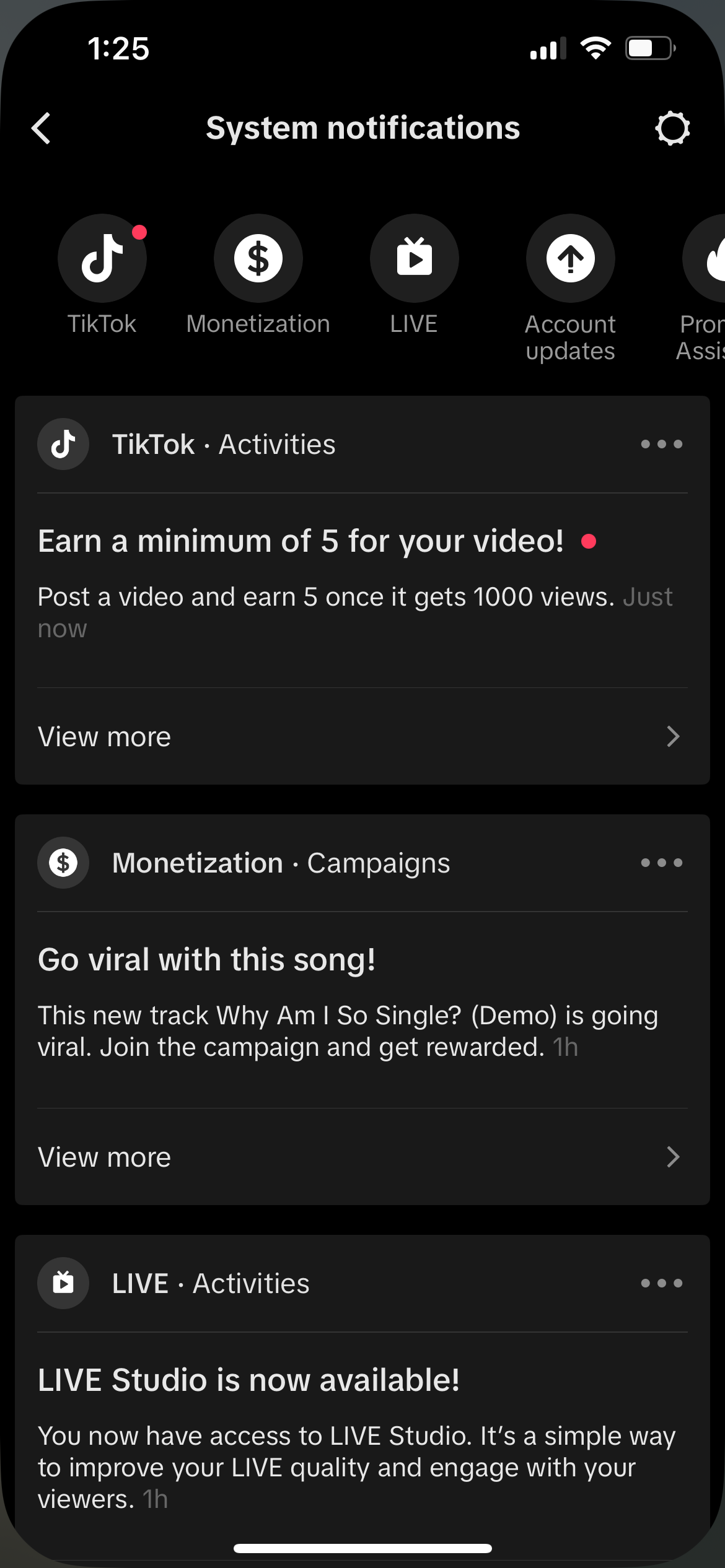 A smartphone screen displays notifications from TikTok about earning through videos, going viral with new music, and the availability of LIVE Studio.