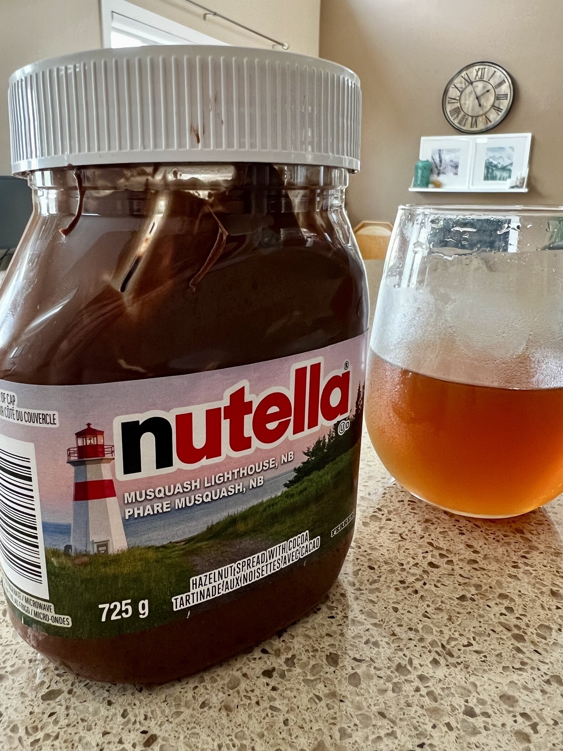 Nutella sitting on a counter. 