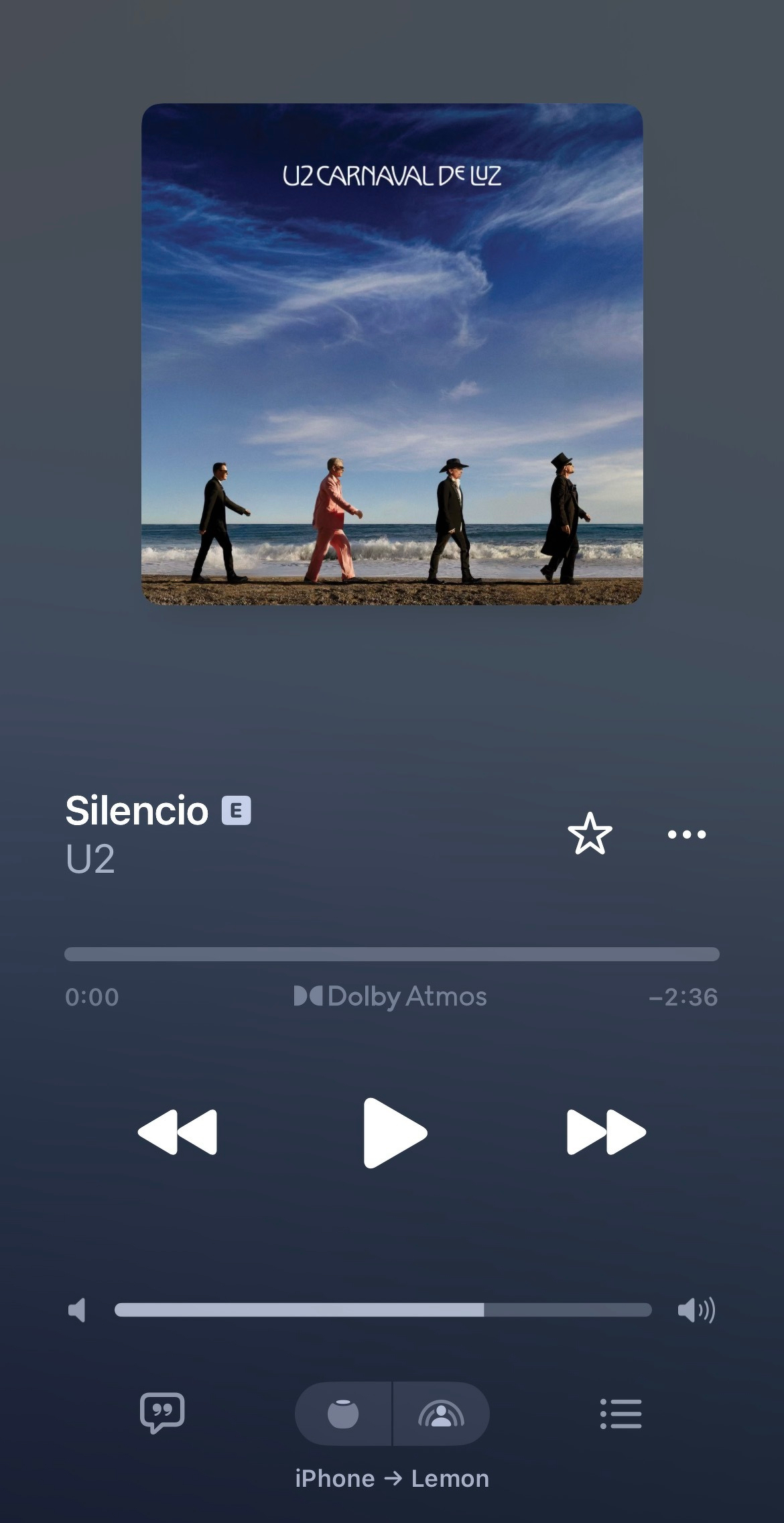 U2's song Silencio from the album U2 Carnaval De Luz is displayed on a music player with controls for play, pause, and volume.