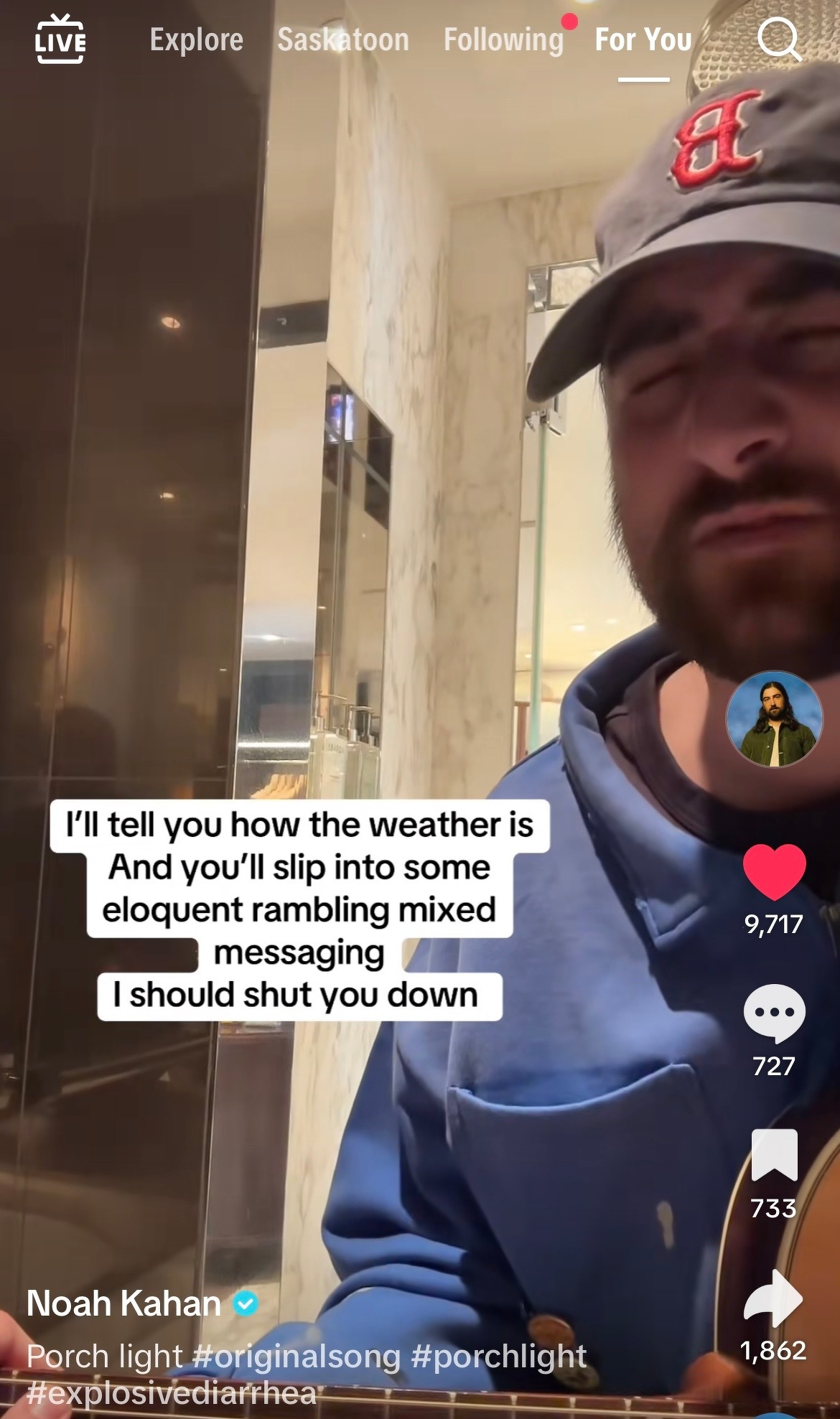 Noah Kahan wearing a cap is playing a guitar indoors, with text overlay containing song lyrics and social media interactions visible.