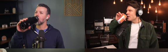 Two men are drinking from cans while speaking into microphones in separate recording setups.