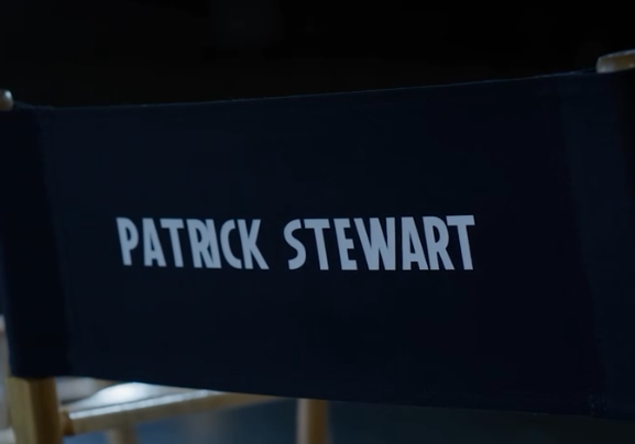 A black director's chair with the name Patrick Stewart printed in white on the backrest is shown.