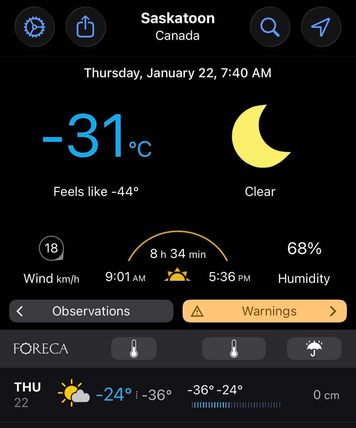 A weather forecast for Saskatoon, Canada, shows a temperature of -31°C with a feels like temperature of -44°C under clear skies.