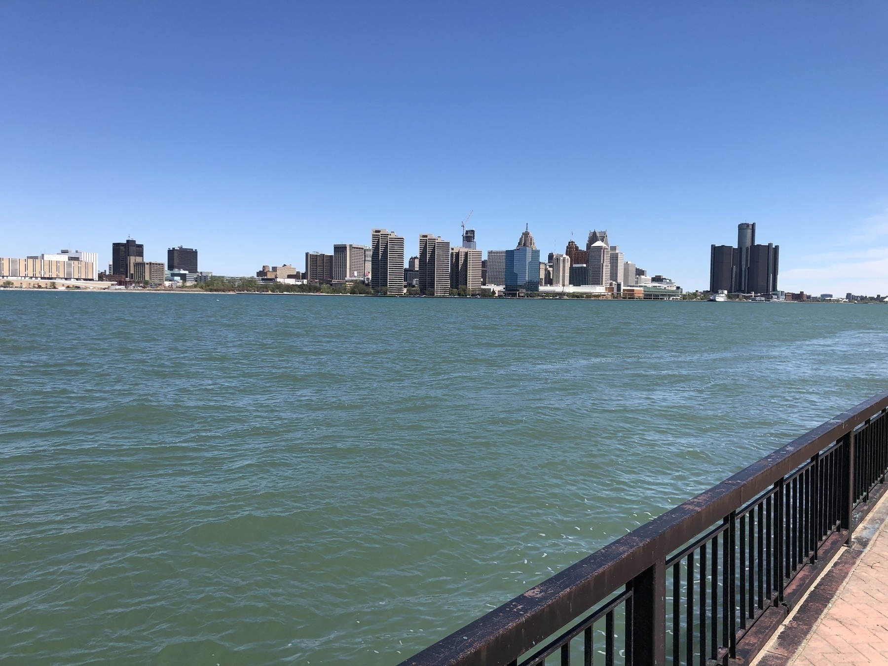 A view of downtown Detroit on a sunny day, taken from the Windsor waterfront on the Canadian side. 