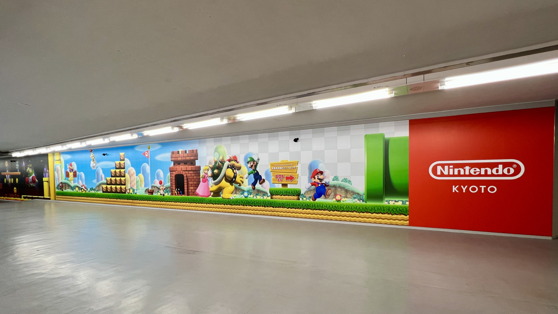 Illustration of Mario, Luigi, Peach, Bowser, and Toad in front of a castle. A large sign says "Nintendo Kyoto"