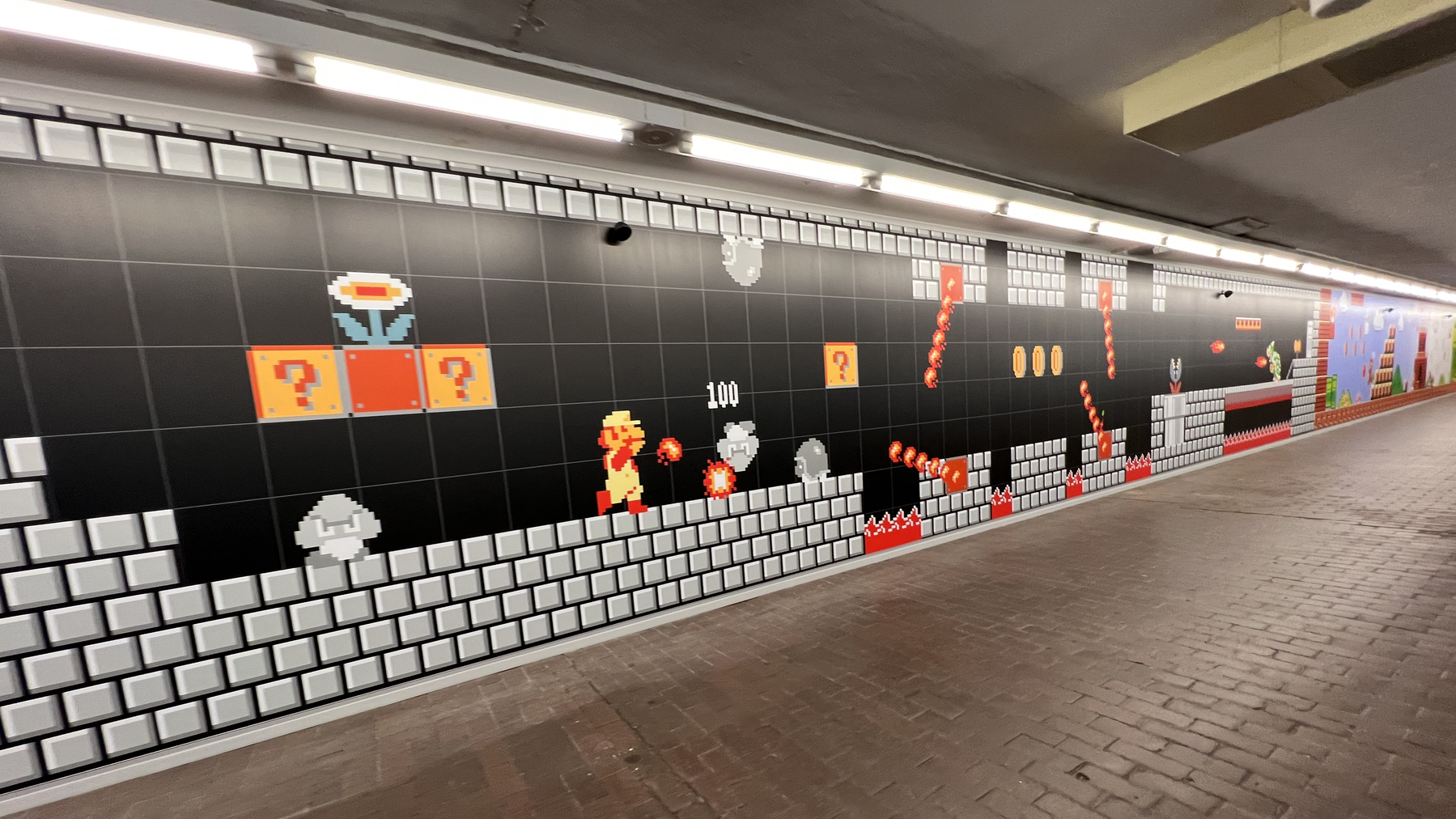 Wall mural with scene of Super Mario going through a dungeon