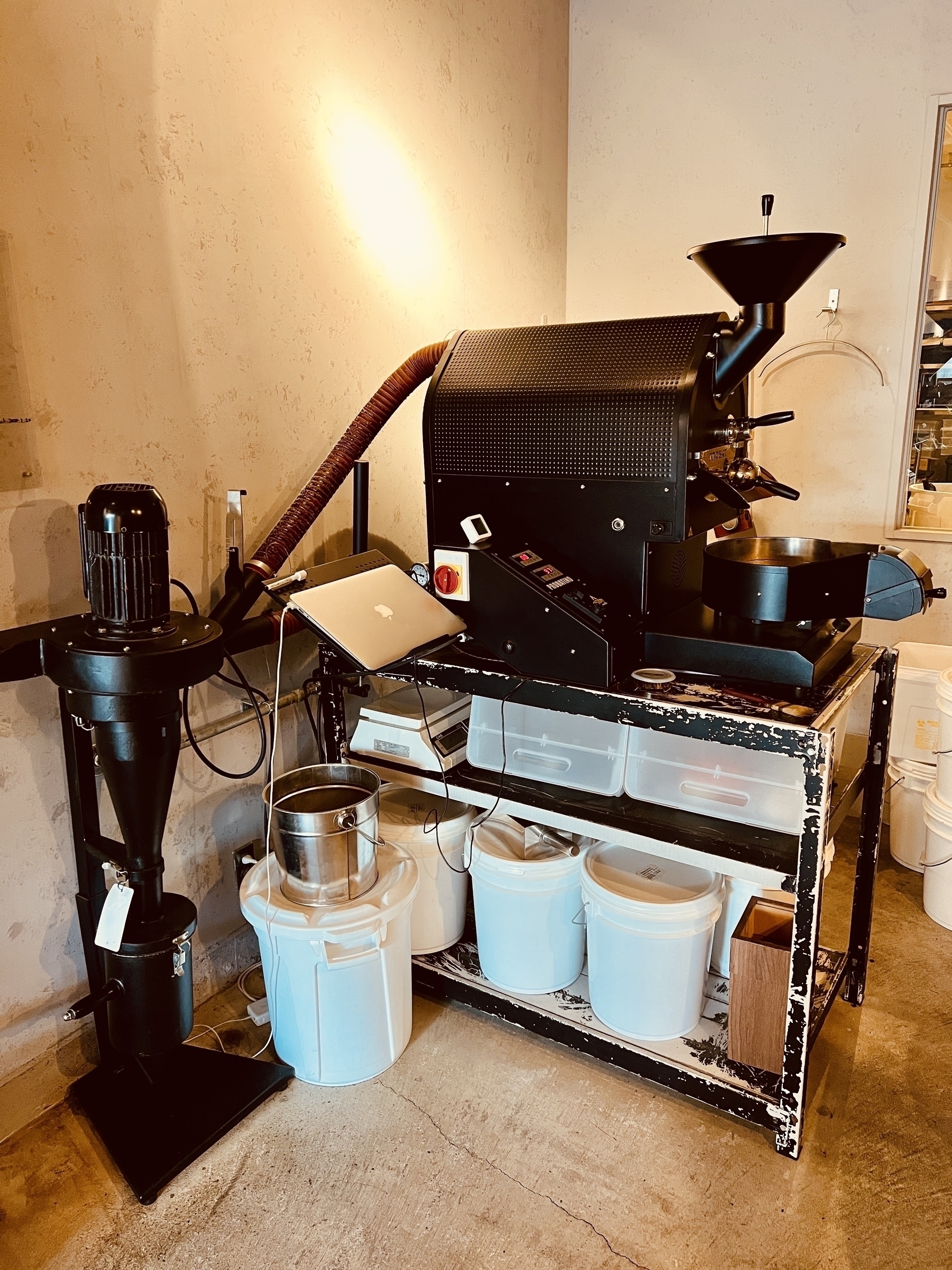 Coffee roasting machine with attached MacBook Air