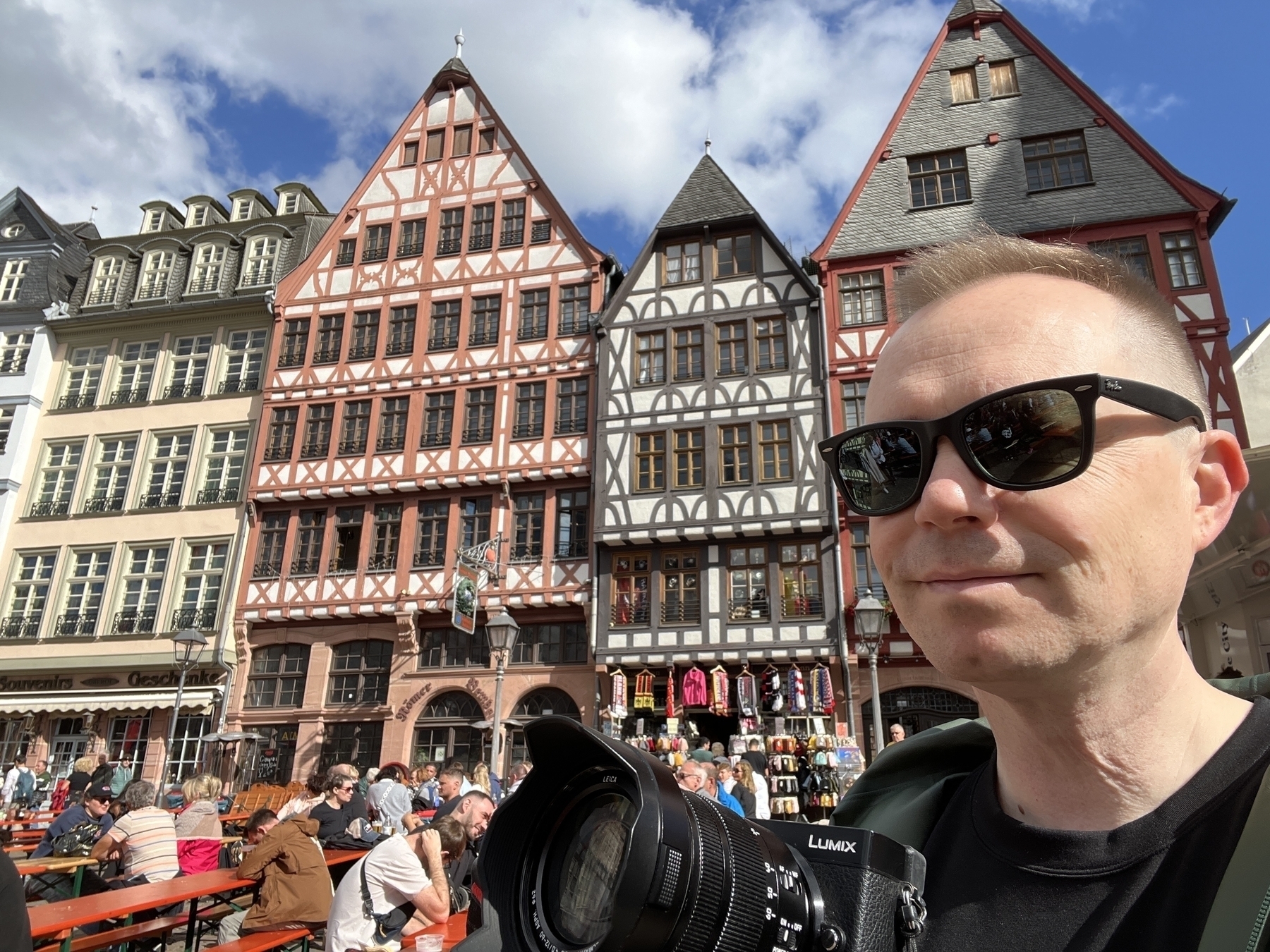 Chad poses with camera in front of the classic German buildings of Römerberg