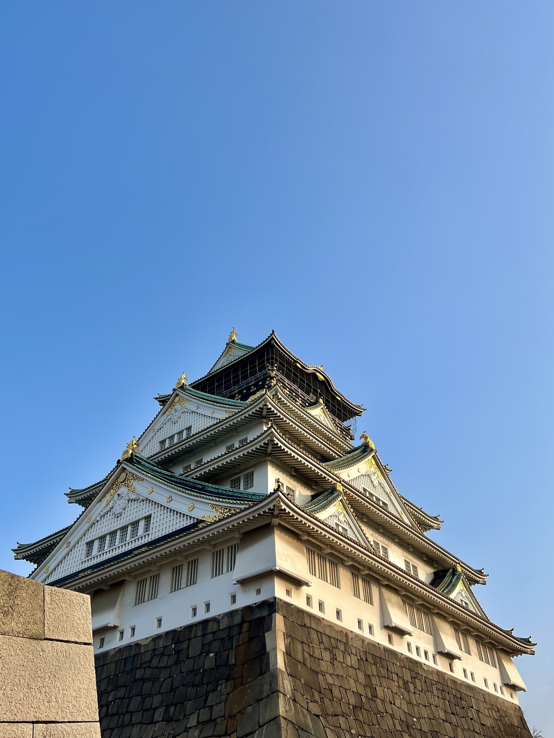 Osaka castle against a cloudless sky