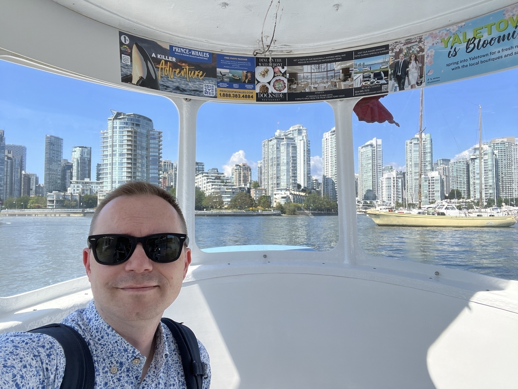 Chad selfie inside the boat with Yaletown in background 