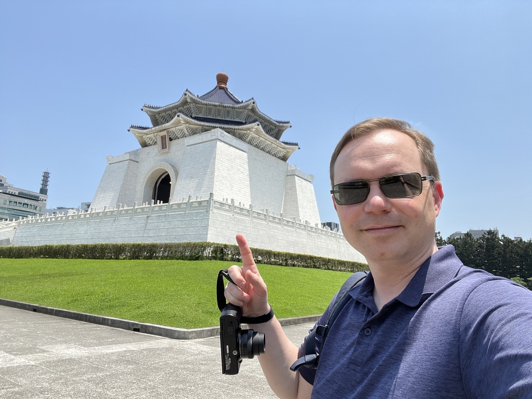 Chad selfie outside the Chiang Kai Shek Memorial, which is a large white building with a long stairway