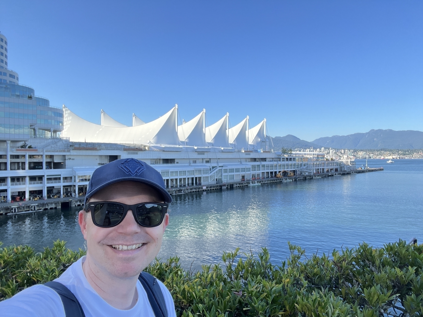 Chad selfie at Canada Place. North Shore mountains in the distance