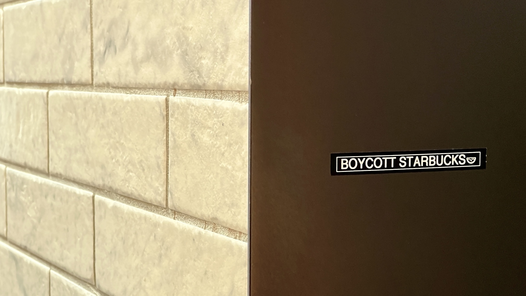 Small sticker on a wall: Boycott Starbucks