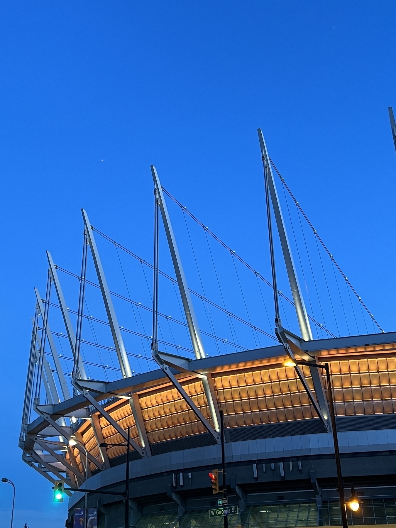 BC Place against a clear blue sky darkening with evening 