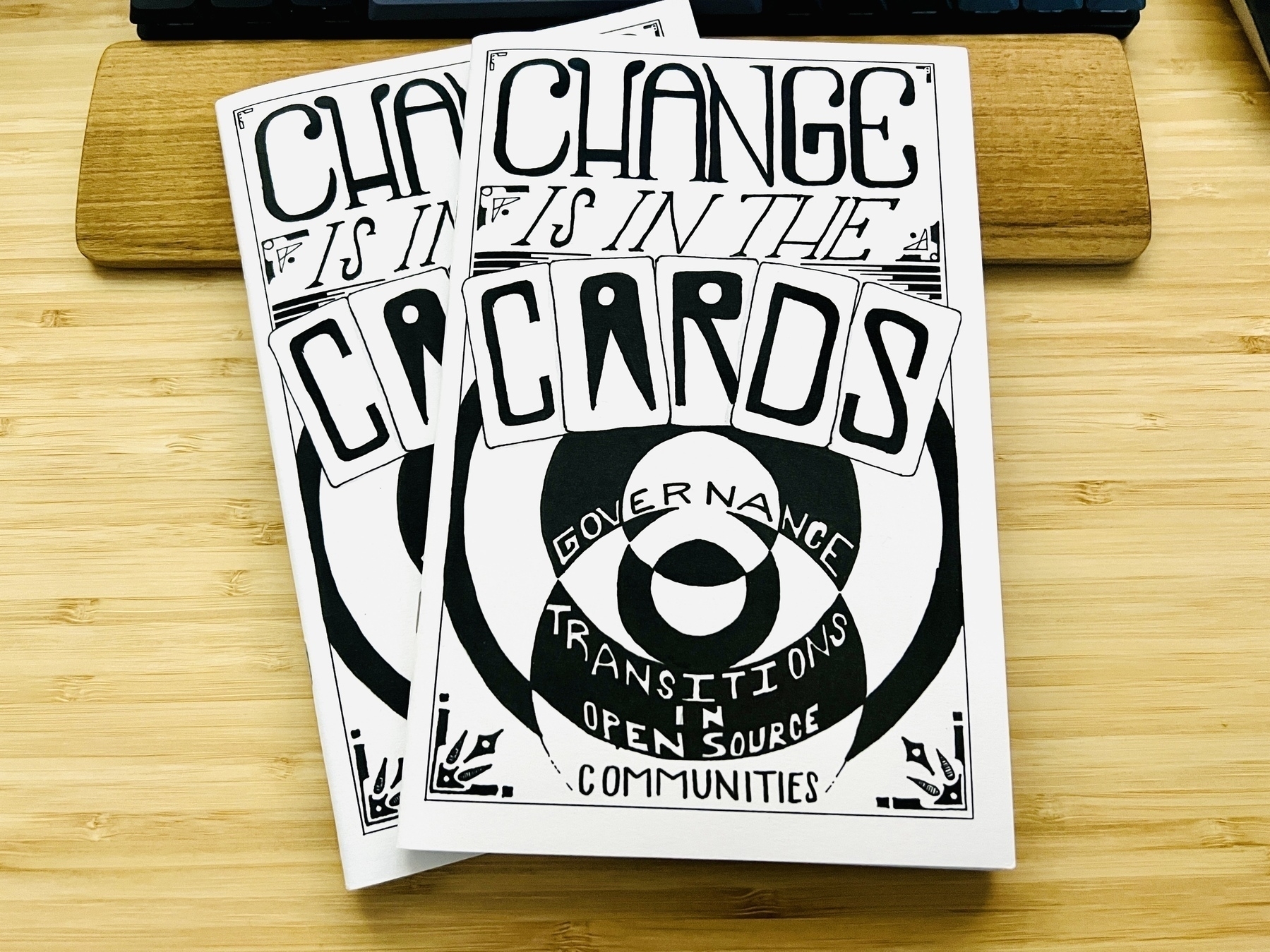 2 copies of the zine “Change is in the cards: Governance Transitions in Open Source Communities”