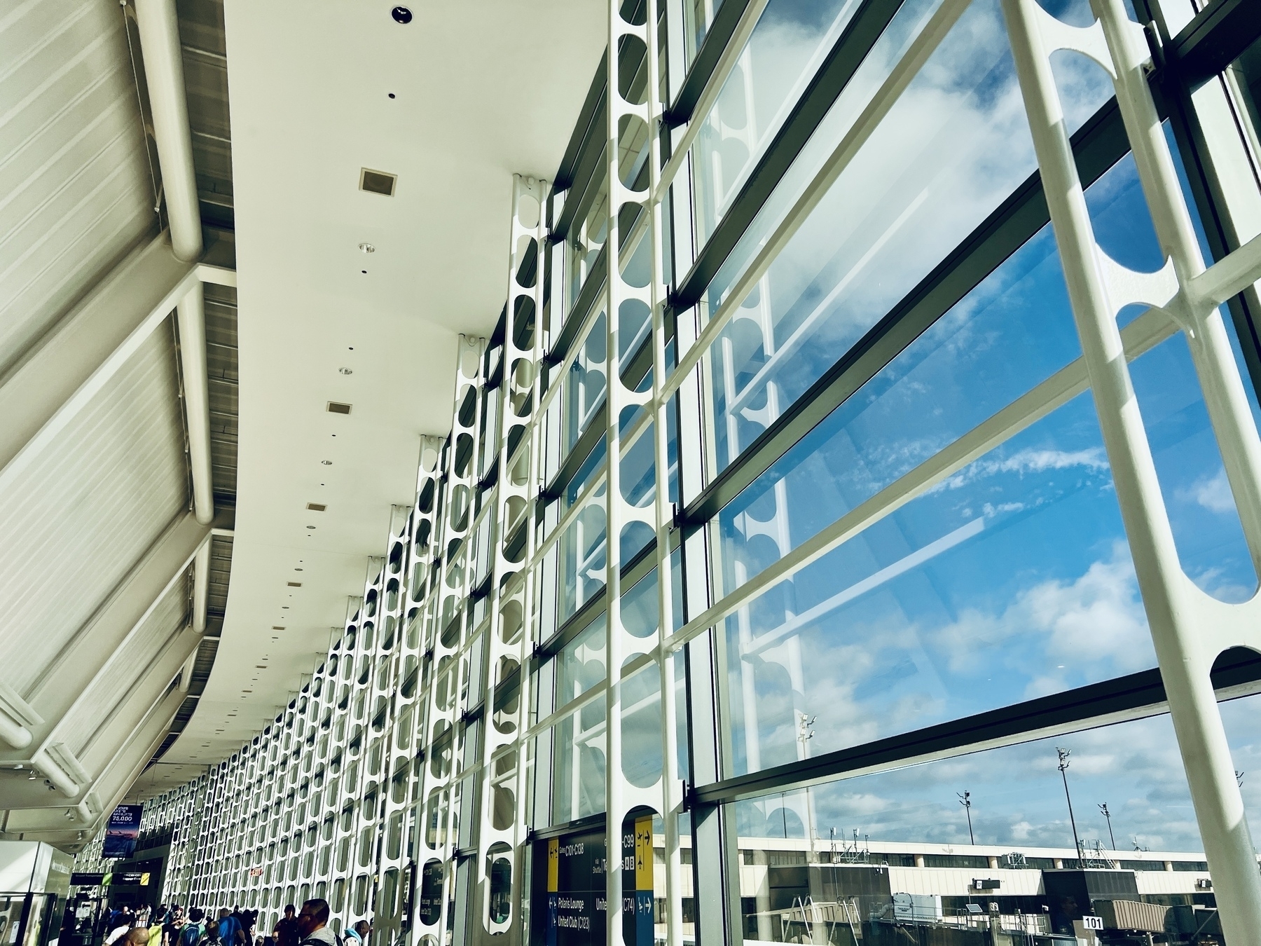 Inside curved wall of Newark airport. Blue sky