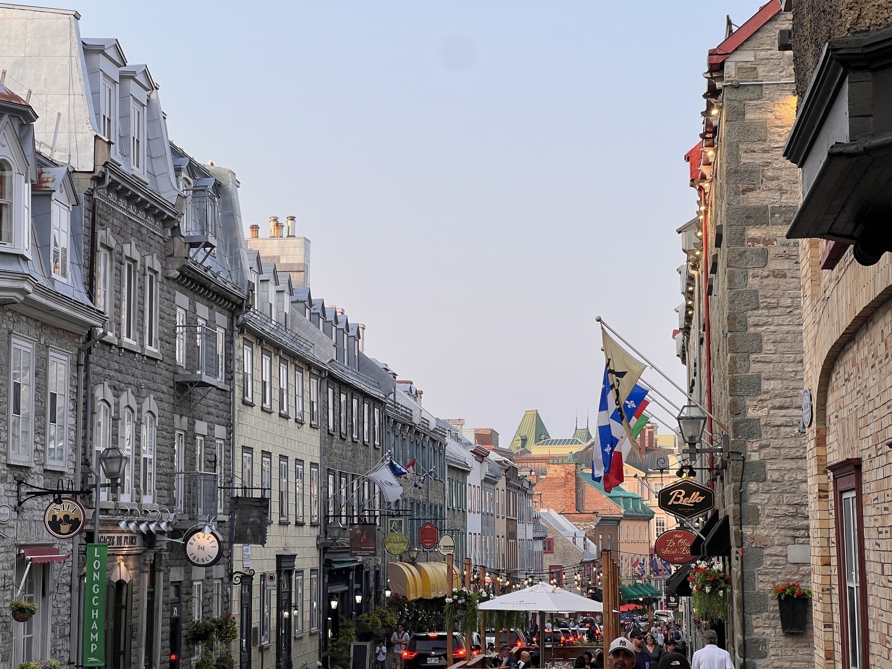 Long shot down the Rue Saint-Louis which looks very European