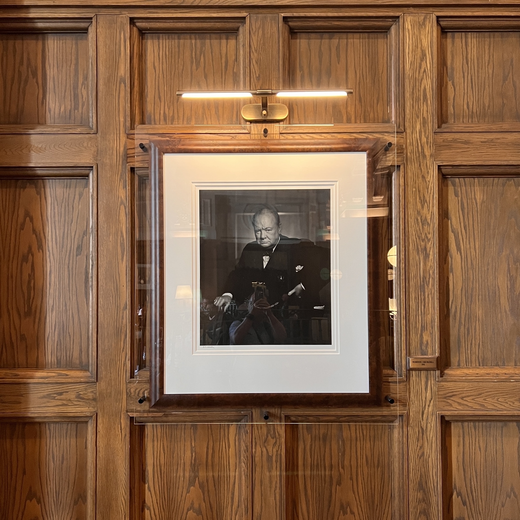 Famous photo of Churchill scowling into the camera because the famous photographer grabbed the cigar out of his mouth right before the picture