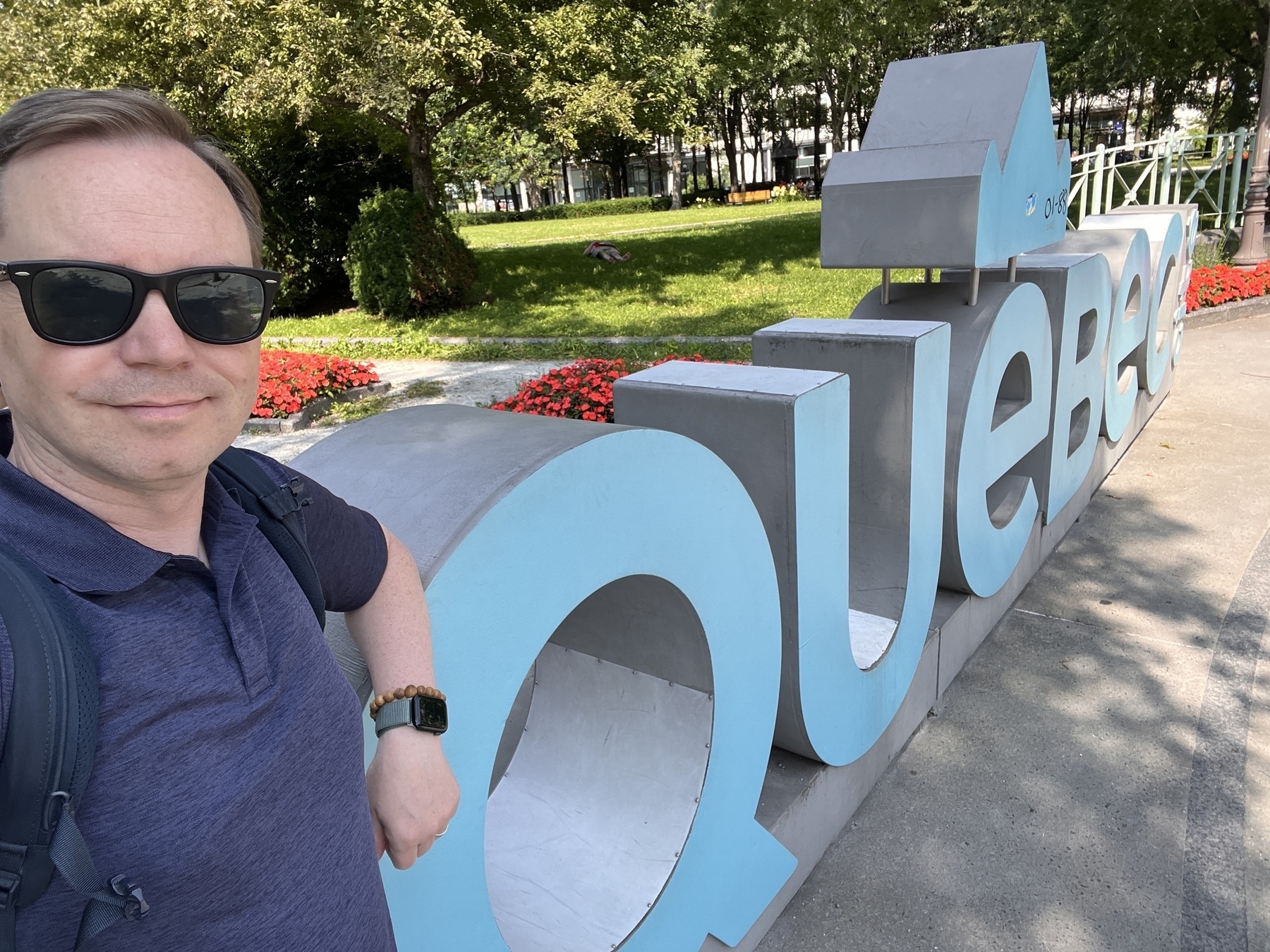 Chad selfie in front of a Quebec sign