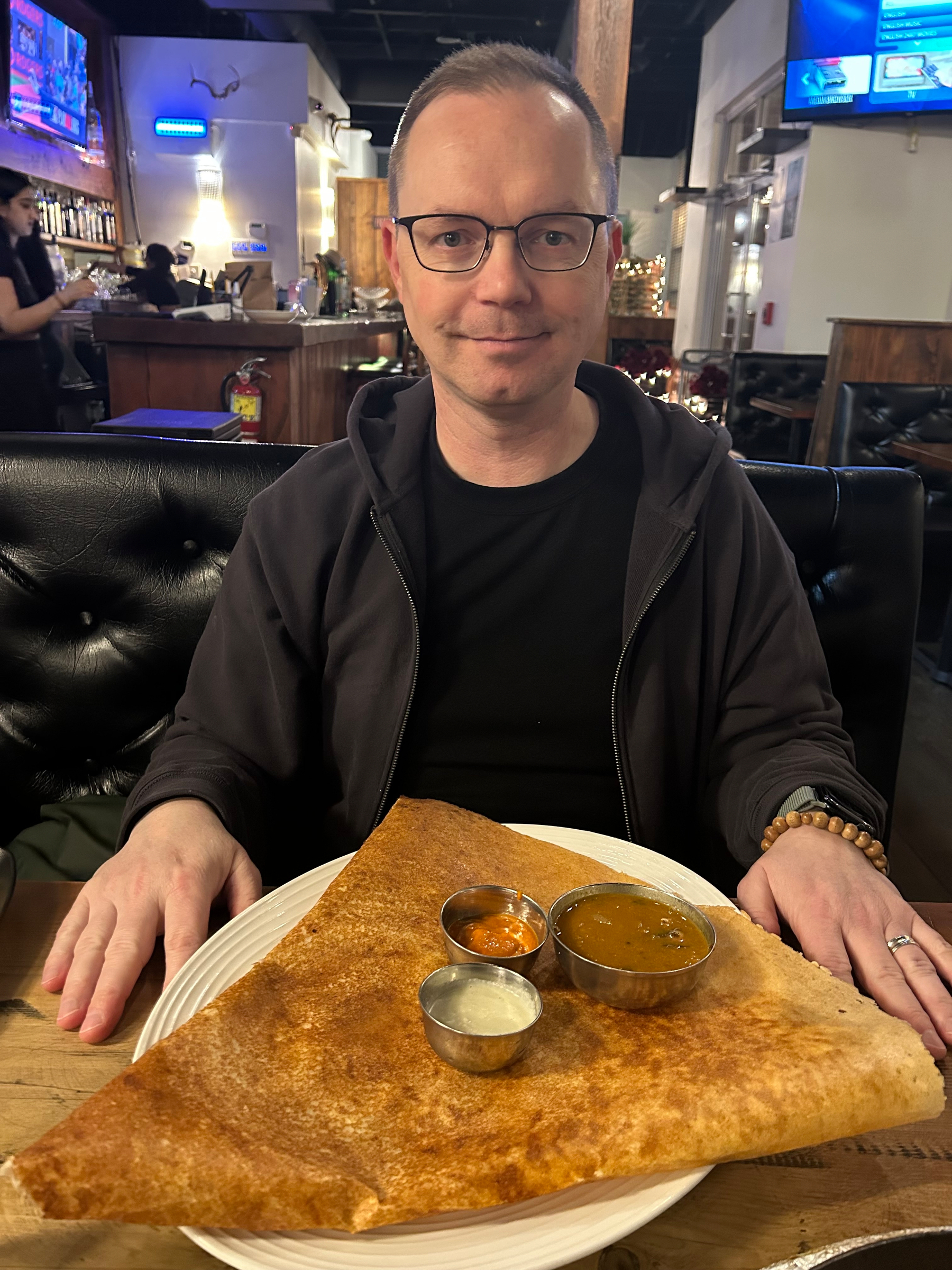 Chad poses with a giant triangular dosa