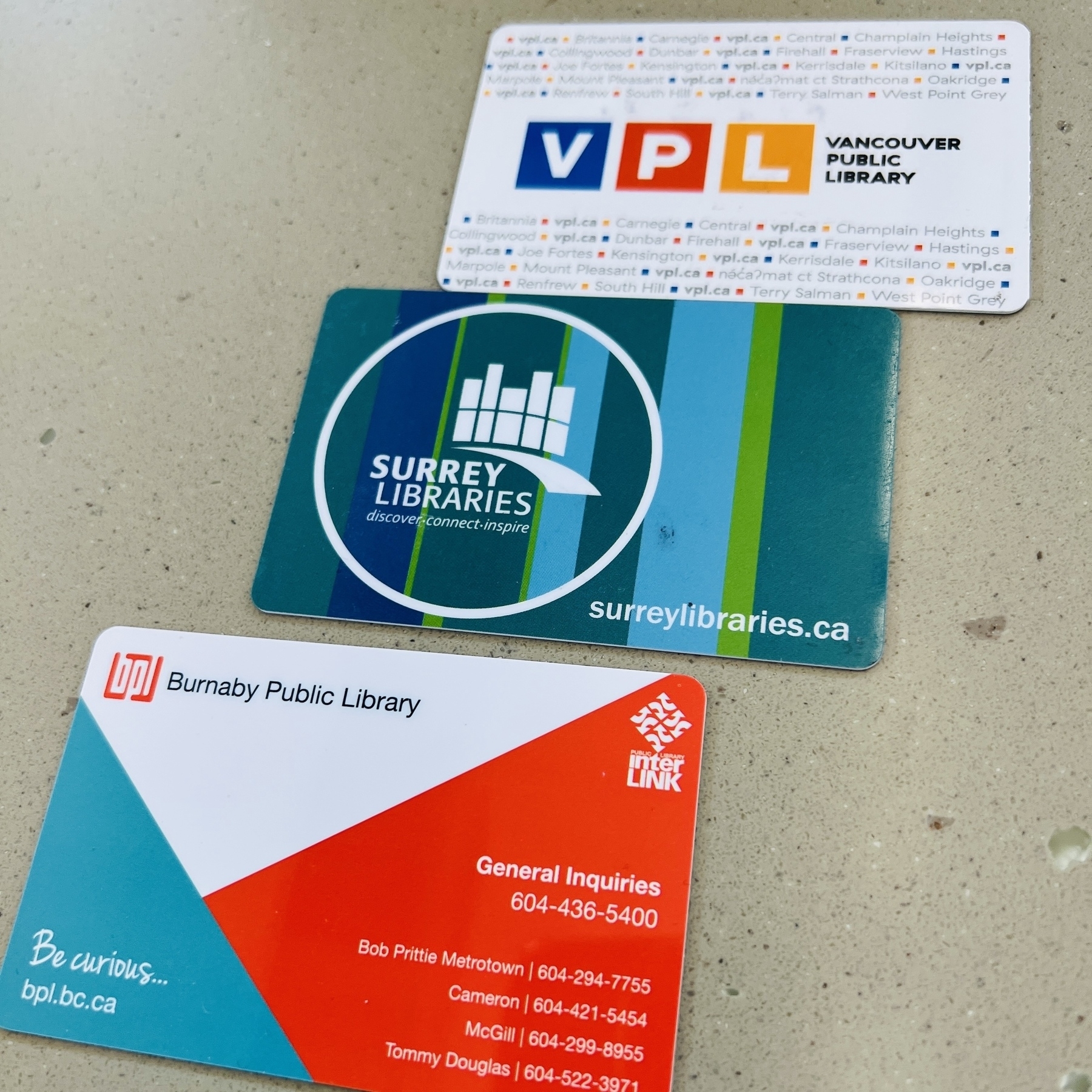 Three library cards from Vancouver, Surrey, Burnaby