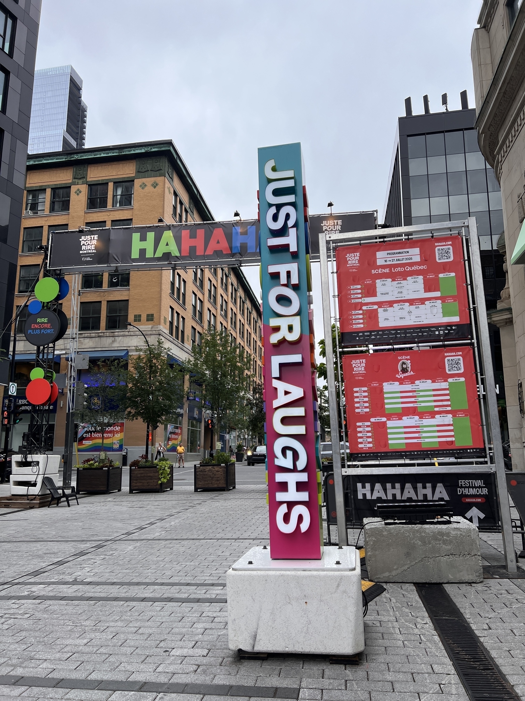 A Just For Laughs street sign and map