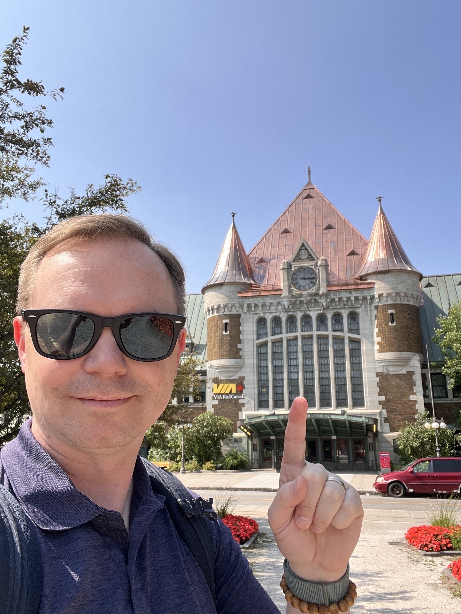 Chad selfie at the cool via rail station with a shiny copper roof