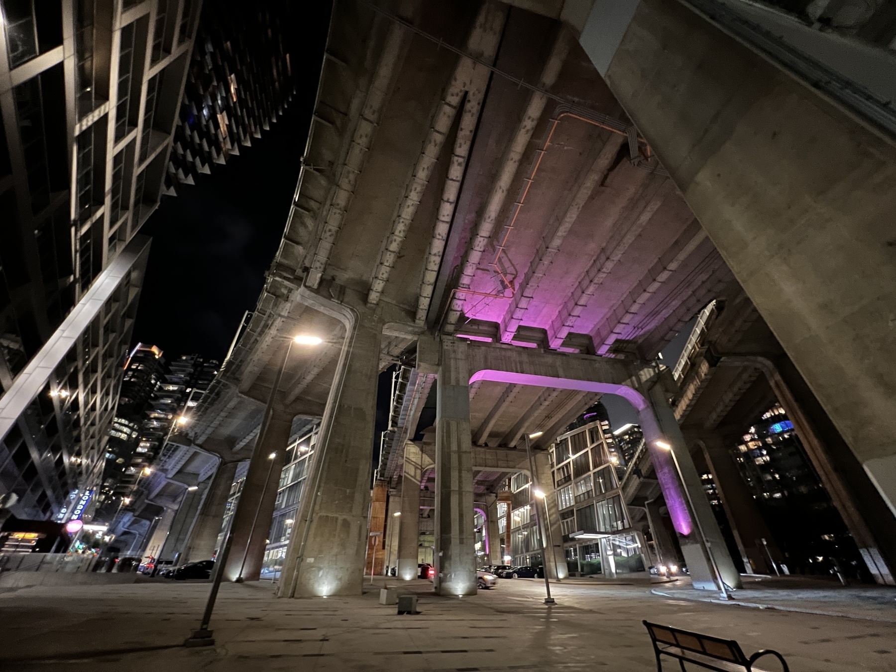 Under Granville bridge and the on ramp from Howe St lit up with a purple light