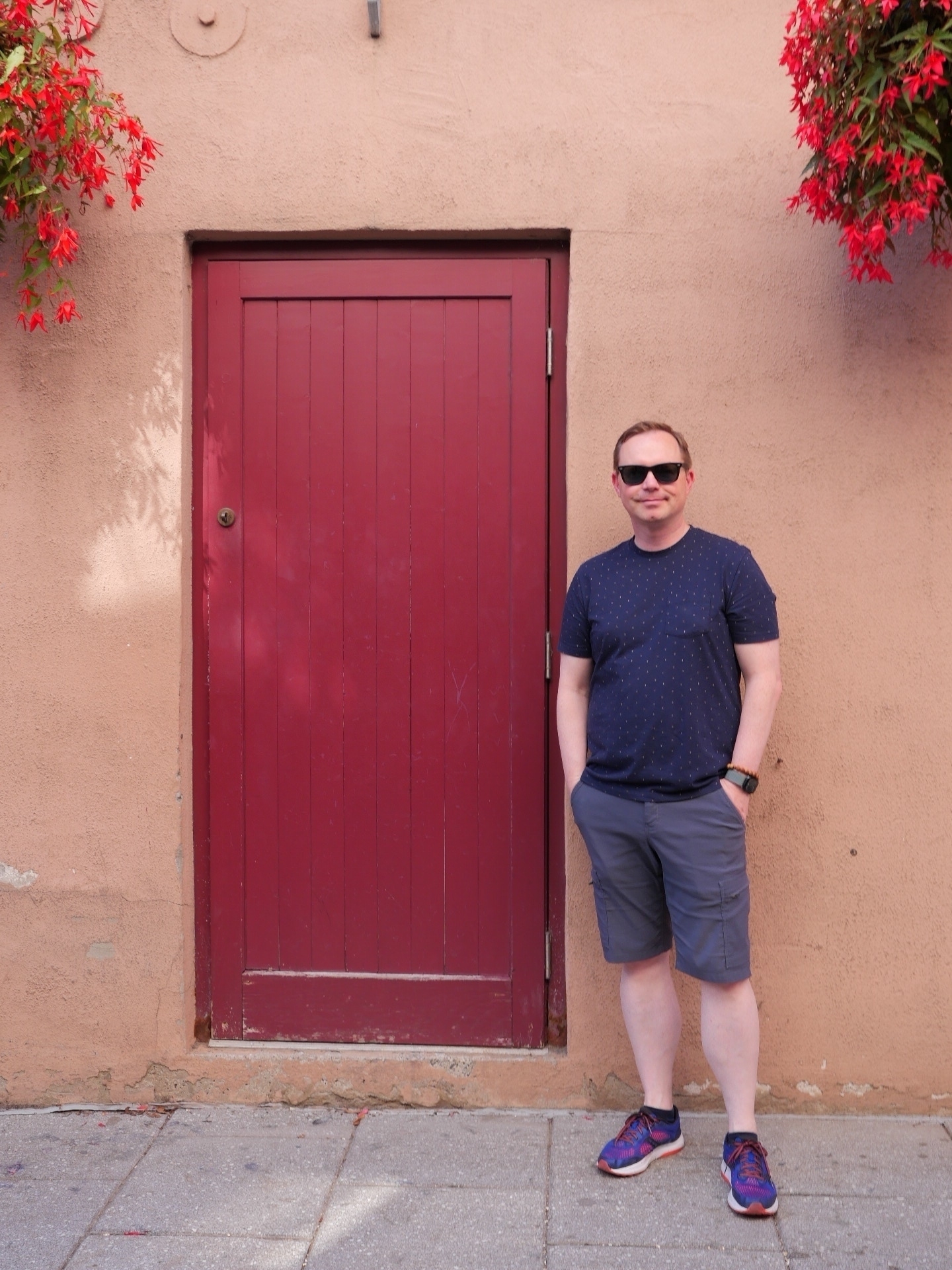 Chad stands beside a Red Door in Lower Quebec