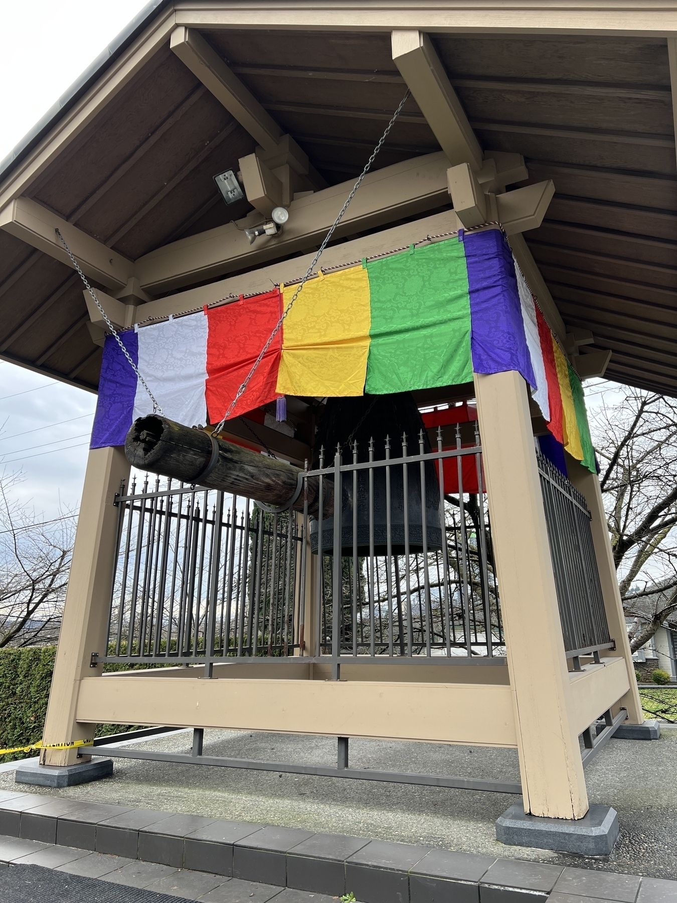 Temple bell with Buddhist flag panels 