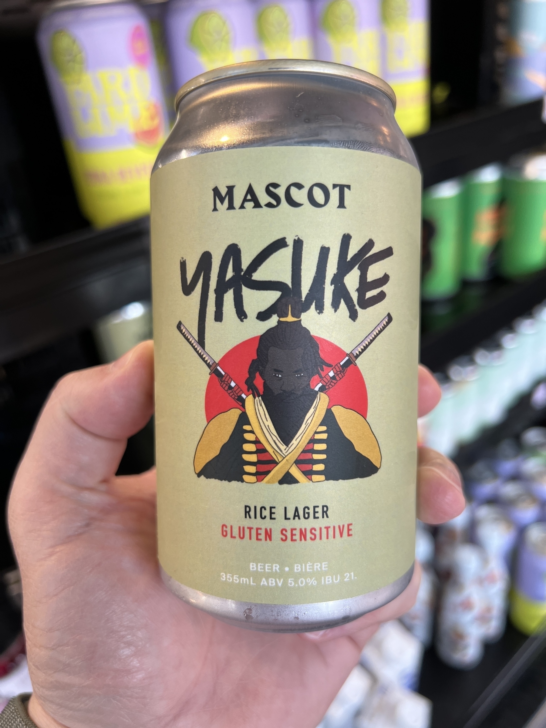 A can of “rice lager” from Mascot with a logo of a black samurai with twin sword strapped to his back and the name YASUKE in letters above his head