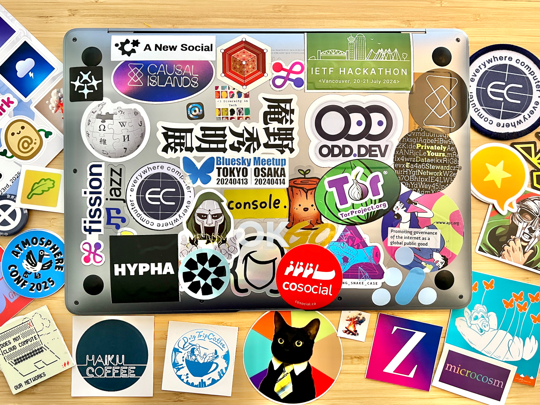 Laptop covered in stickers… and surrounded by even more stickers that need a new laptop to be stuck to