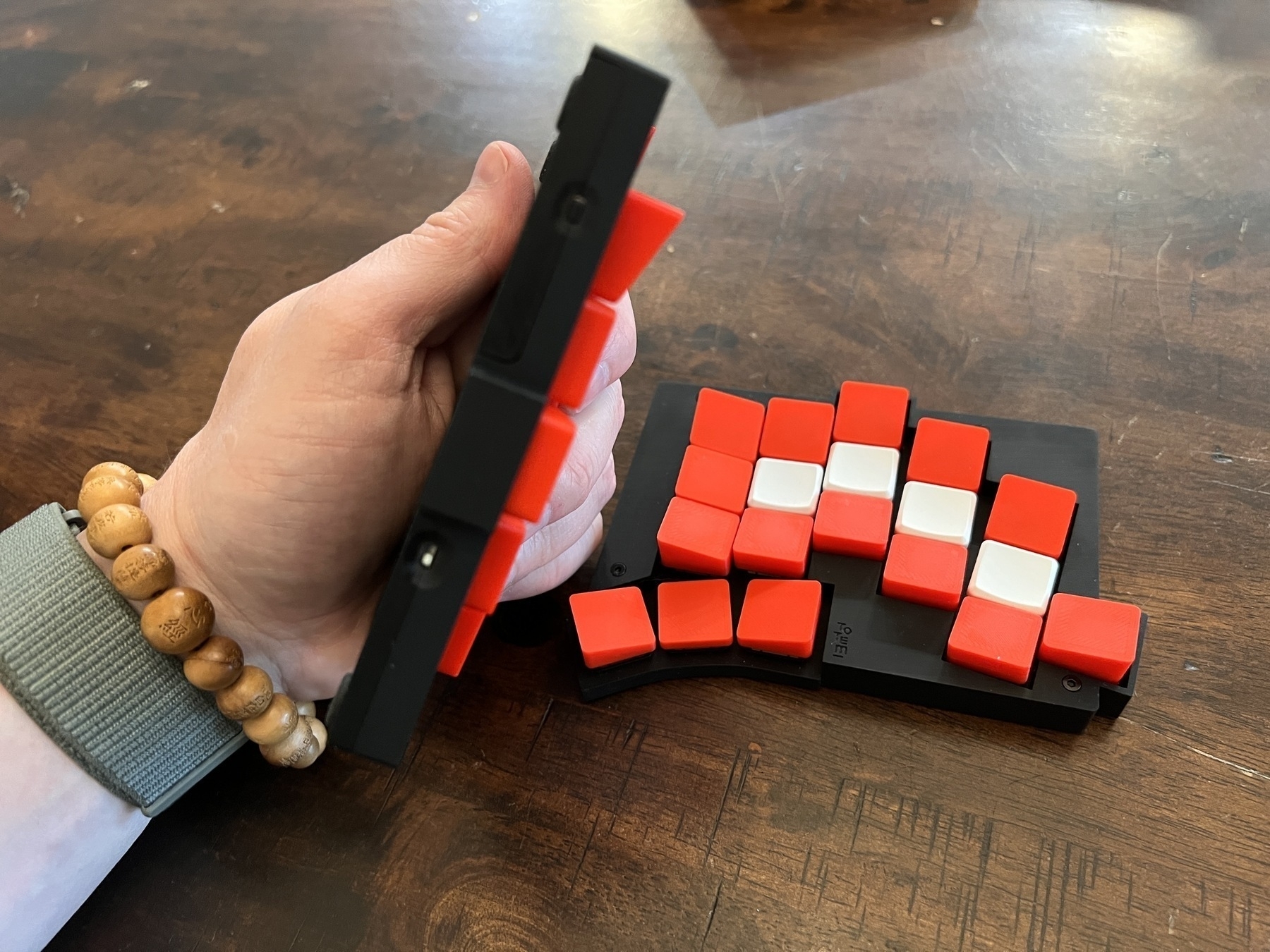 Chad holds the keyboard to demonstrate how thin it is