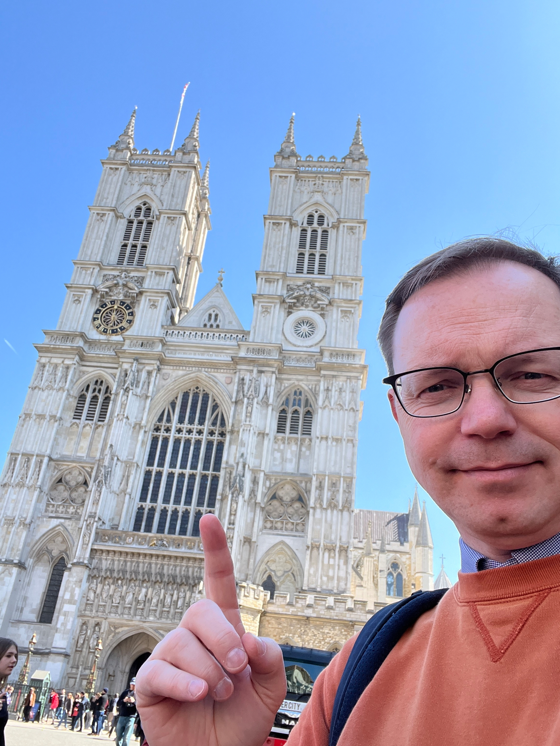 Chad selfie pointing at Westminster Abbey