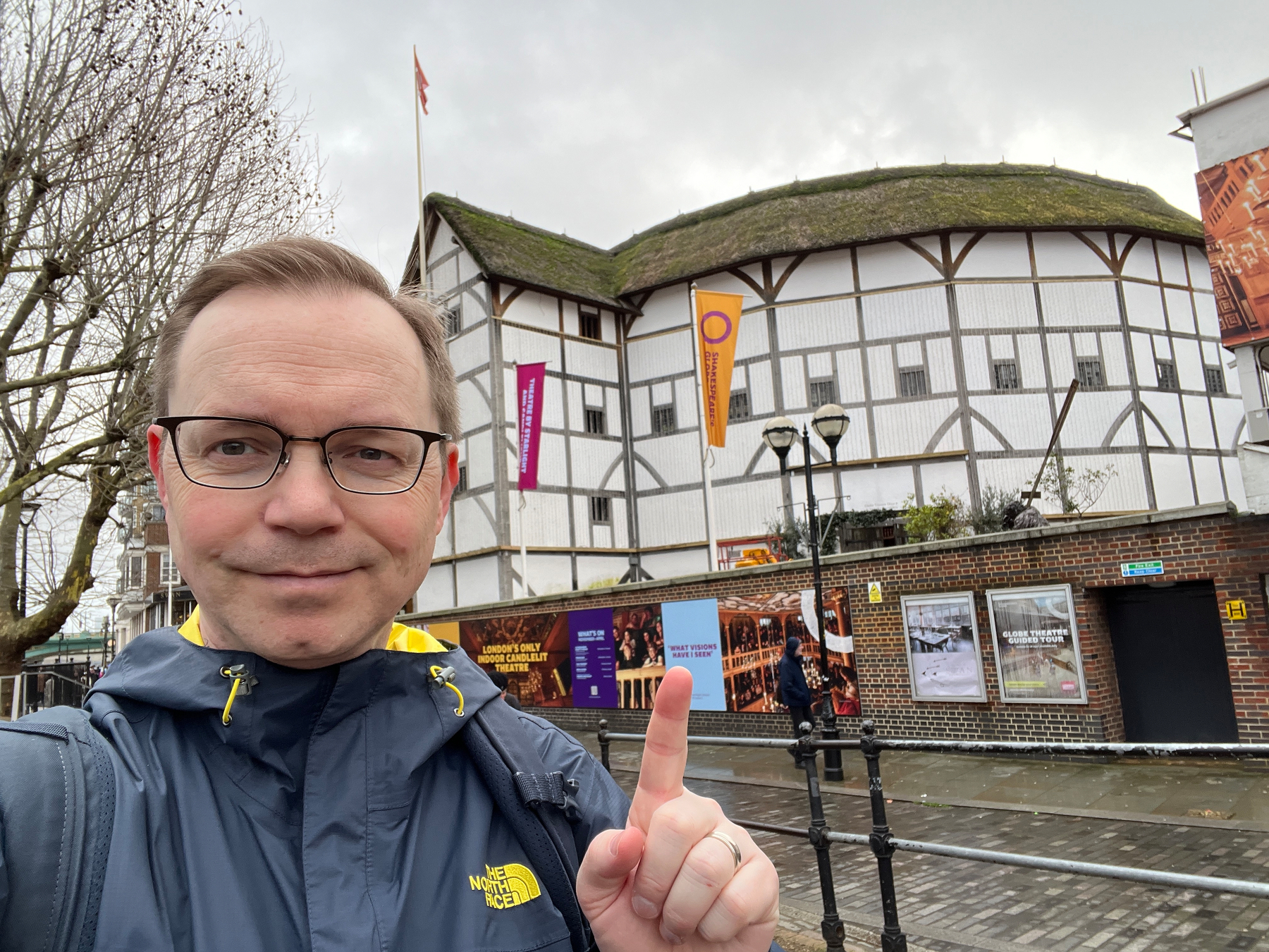 Chad pointing at the Globe Theatre