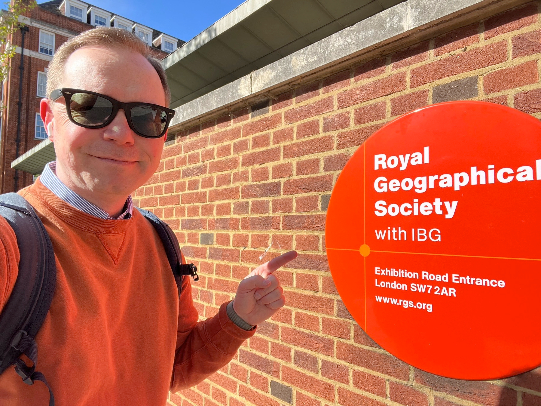 Chad poses in front of the sign for the RGS
