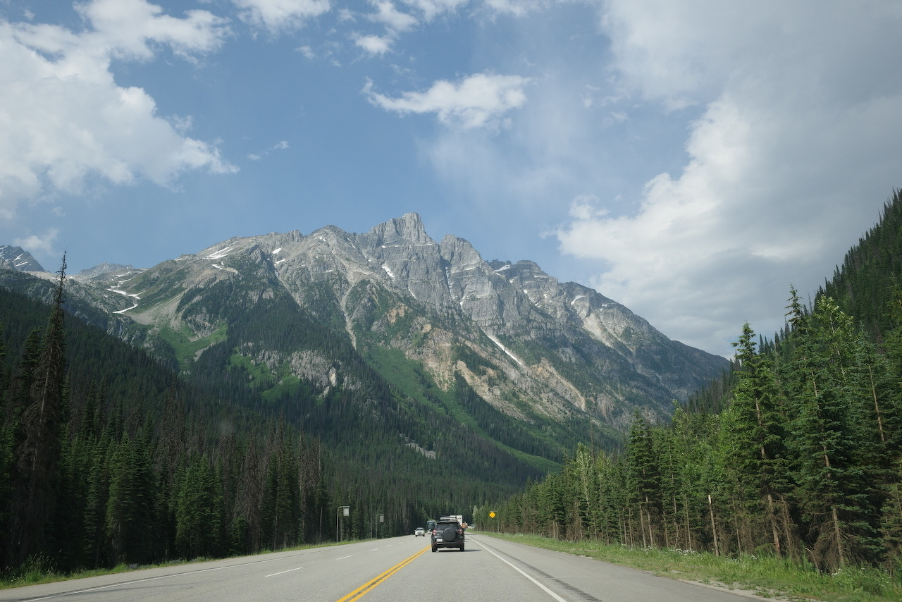 rocky mountaintop above a highway