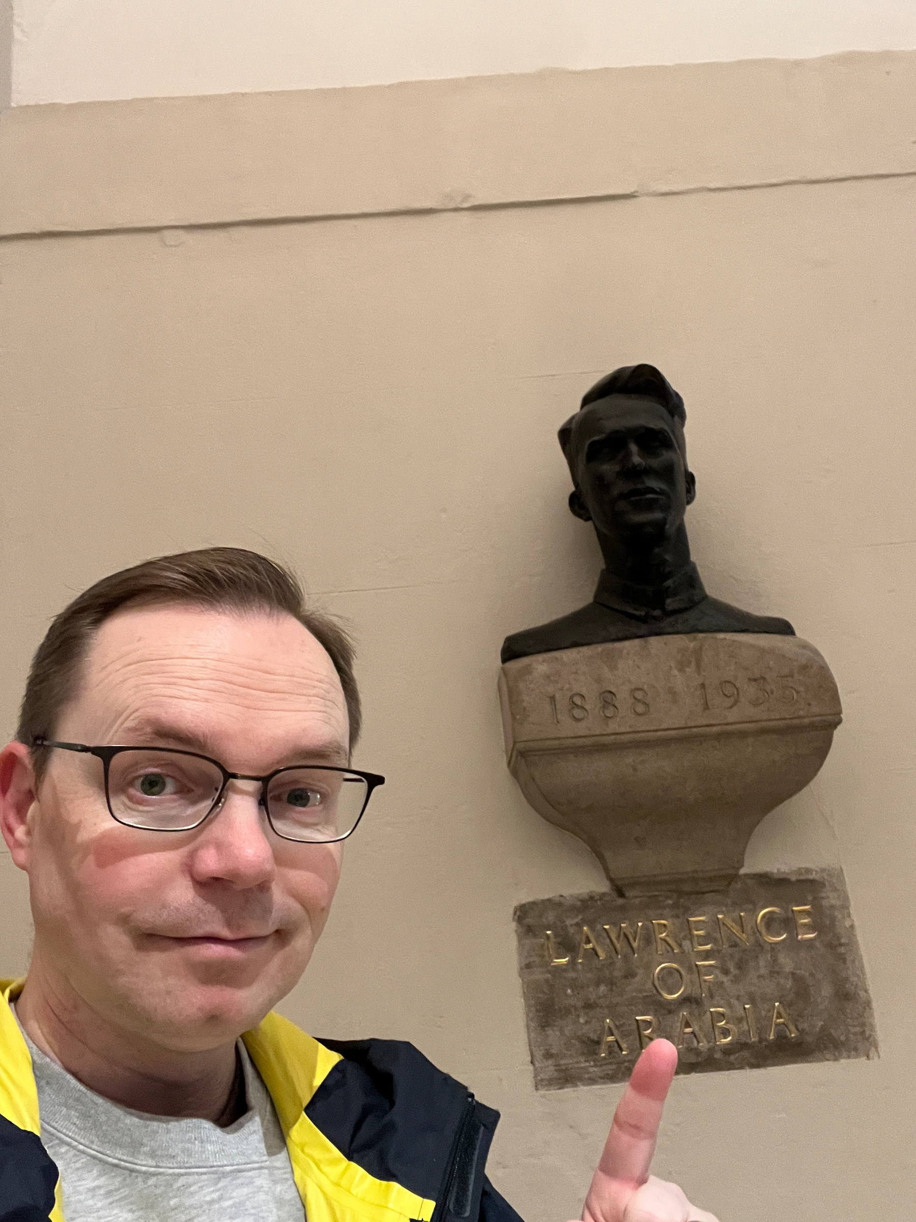 Chad points to a bust of Lawrence of Arabia in the St Paul crypt