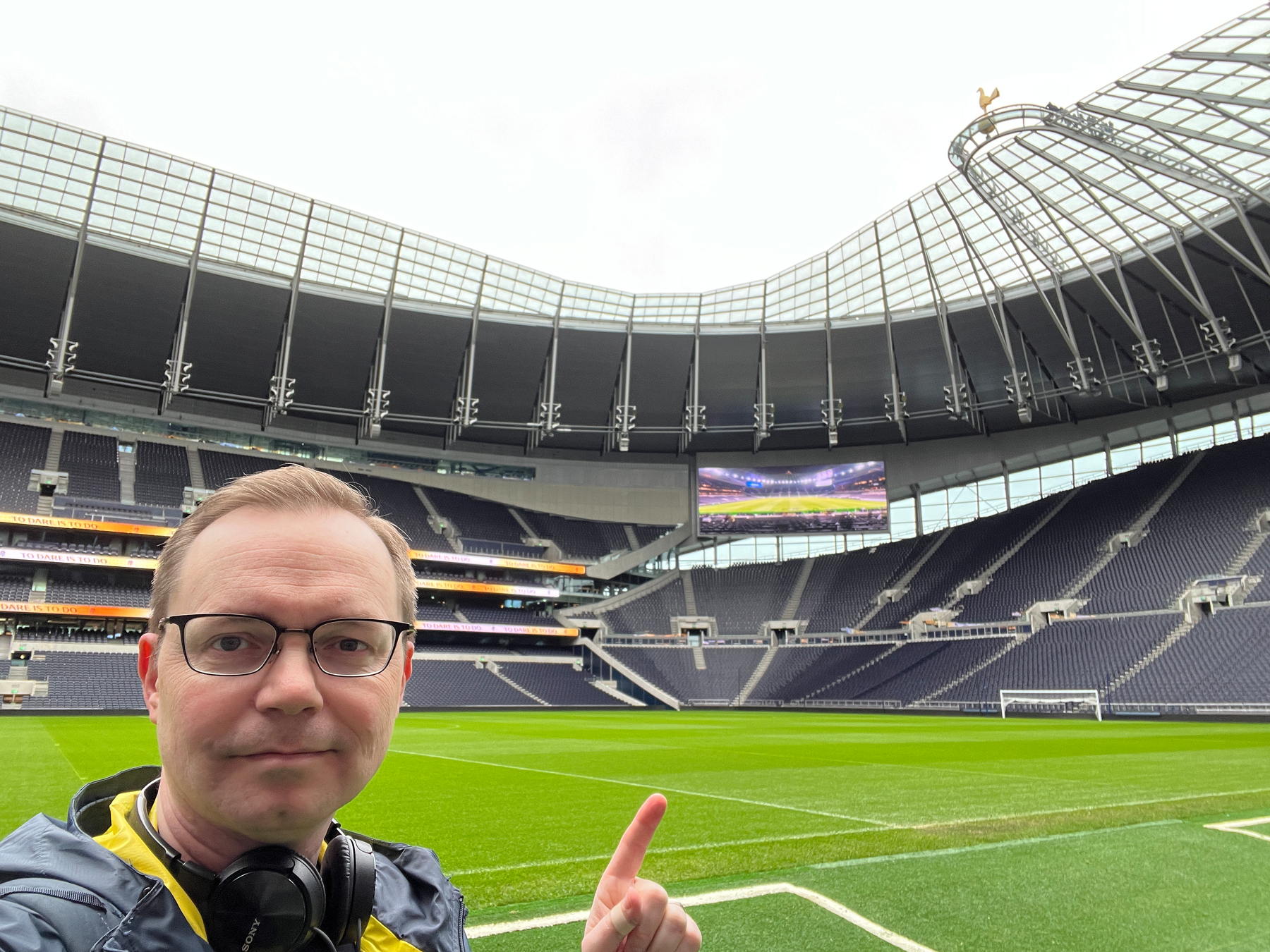 Chad pitch side at Tottenham Hotspur Stadium. To the right is the South Stands above which is the Cockerel and the sky walk