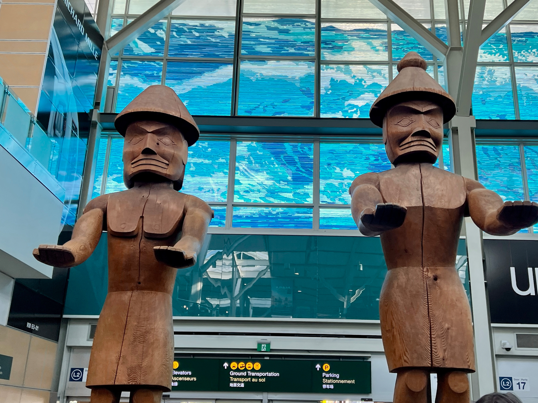 The welcome statues in the YVR arrivals area
