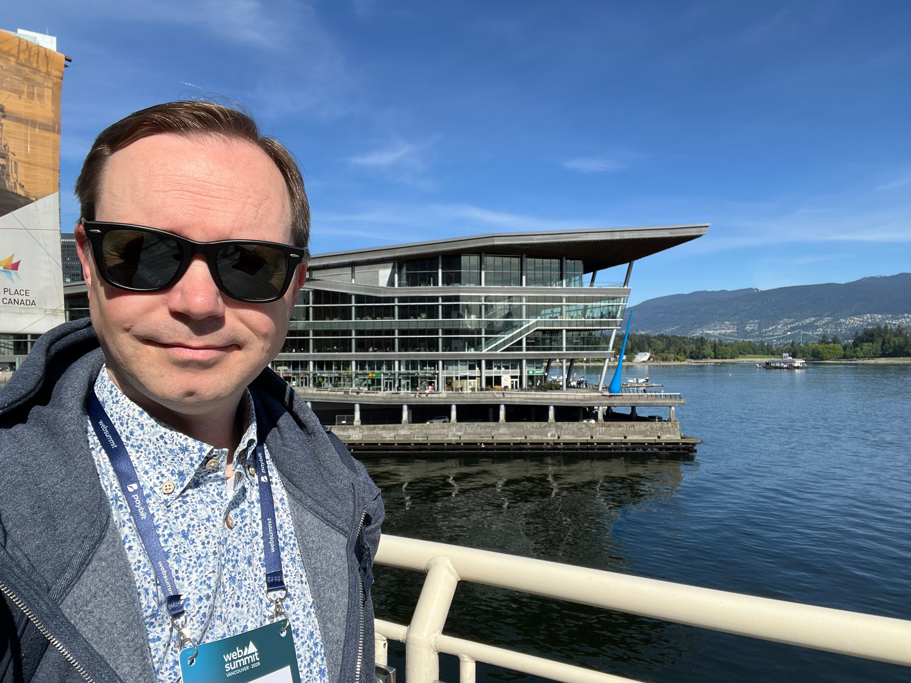 Chad selfie in front of Vancouver Conference Center with a WebSummit badge 