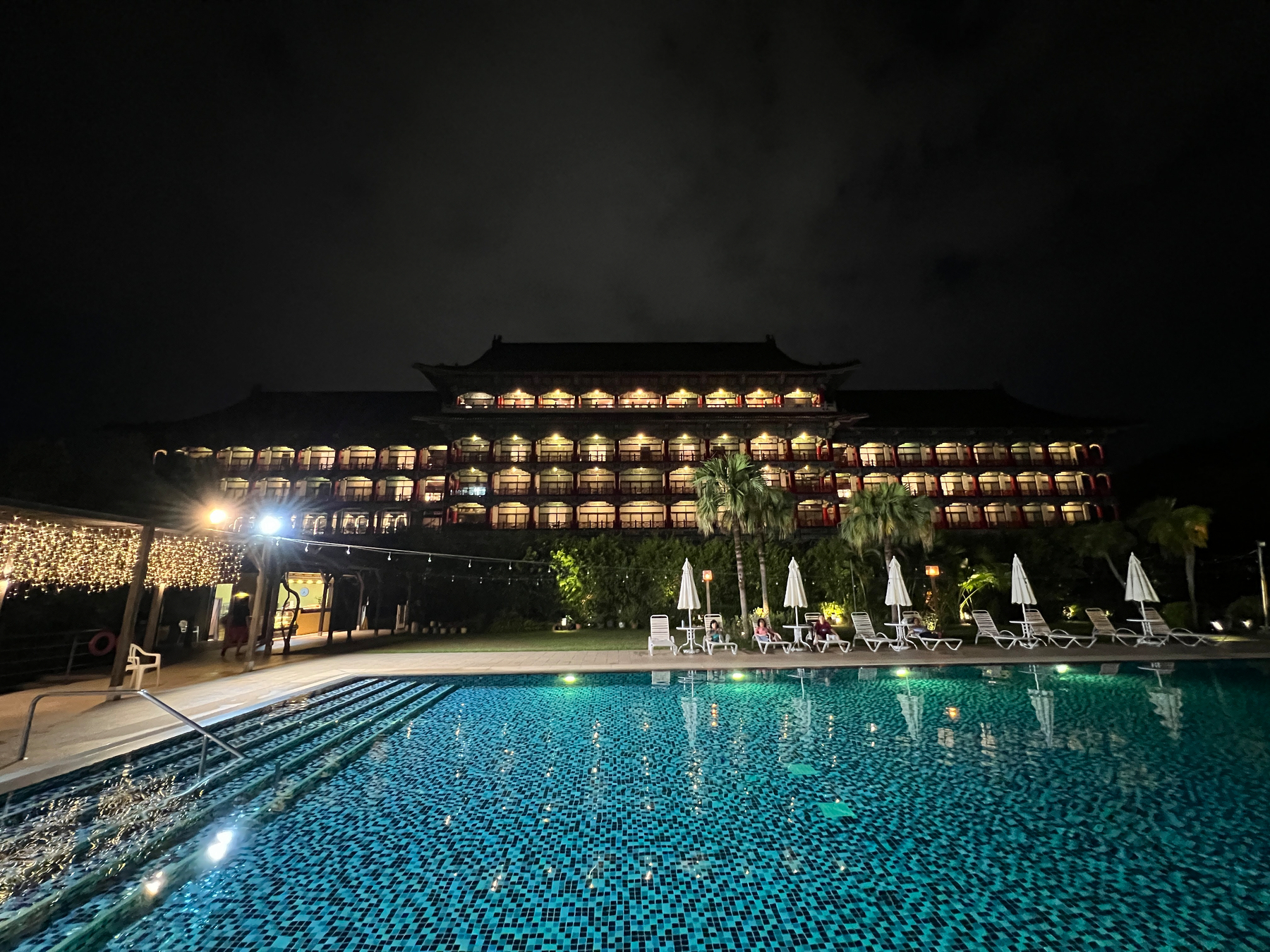 Outdoor pool at the Grand Hotel Kaohsiung at night