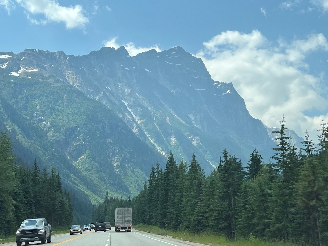 Massive moutain looming over a highway