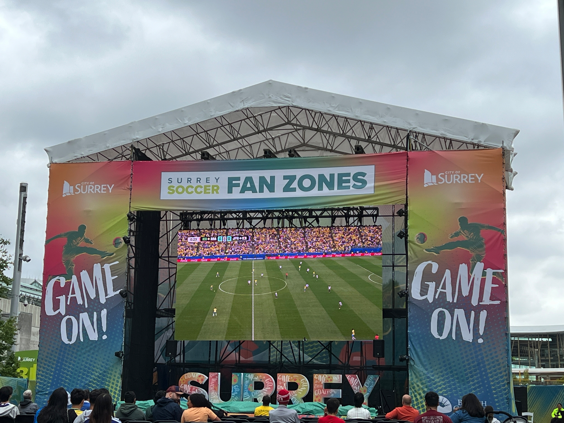 Football match in a large screen outside