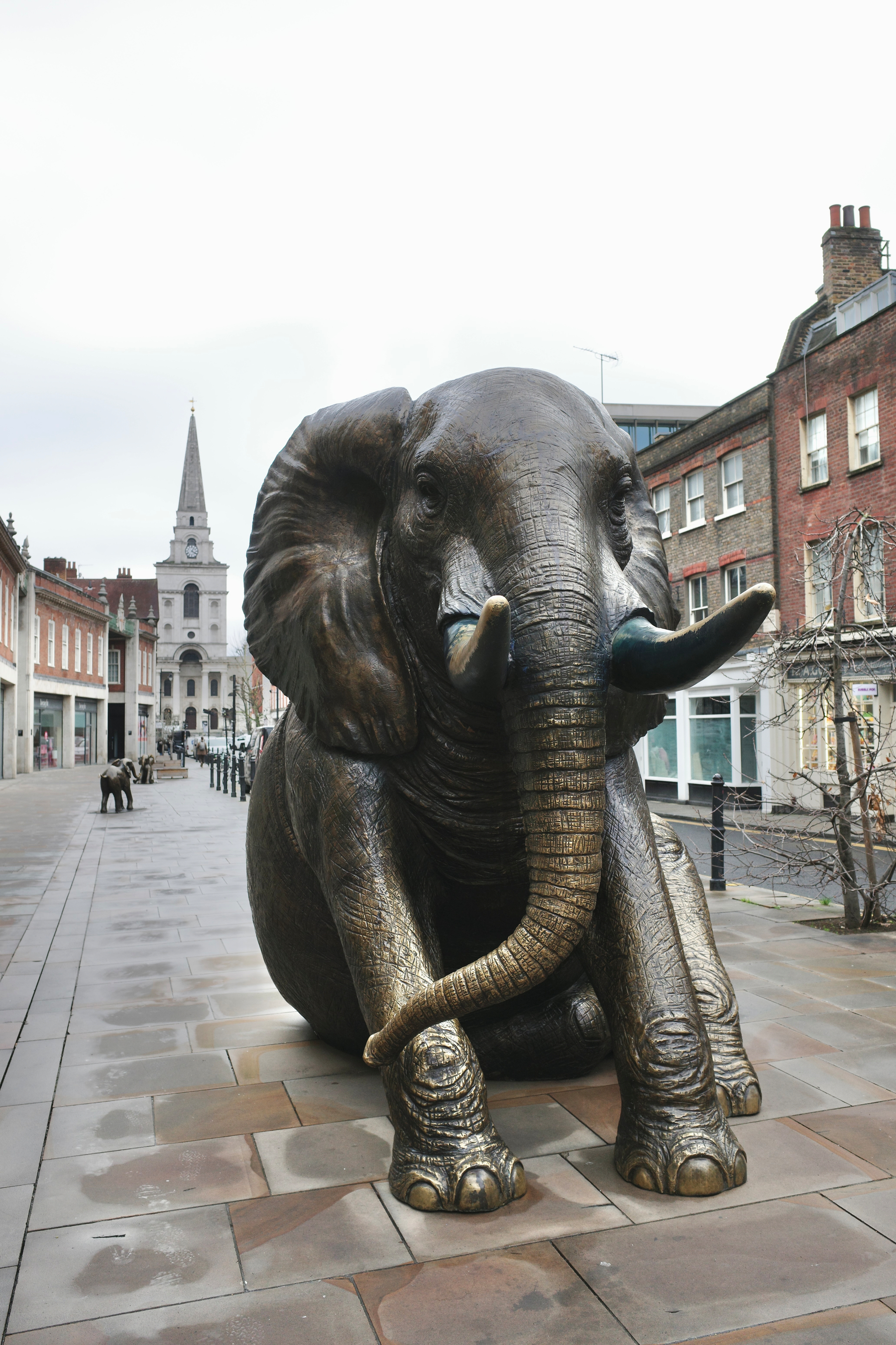 Bronze statue of a seated elephant. In the background is the prominent spire of the Christ Church Spitalfields, one of the Hawksmoor churches. This is a photo from my visit to London last month. I stayed just behind this church in Brick Lane, unknowing of its legendary occult status (at least in the novels of Peter Ackroyd)