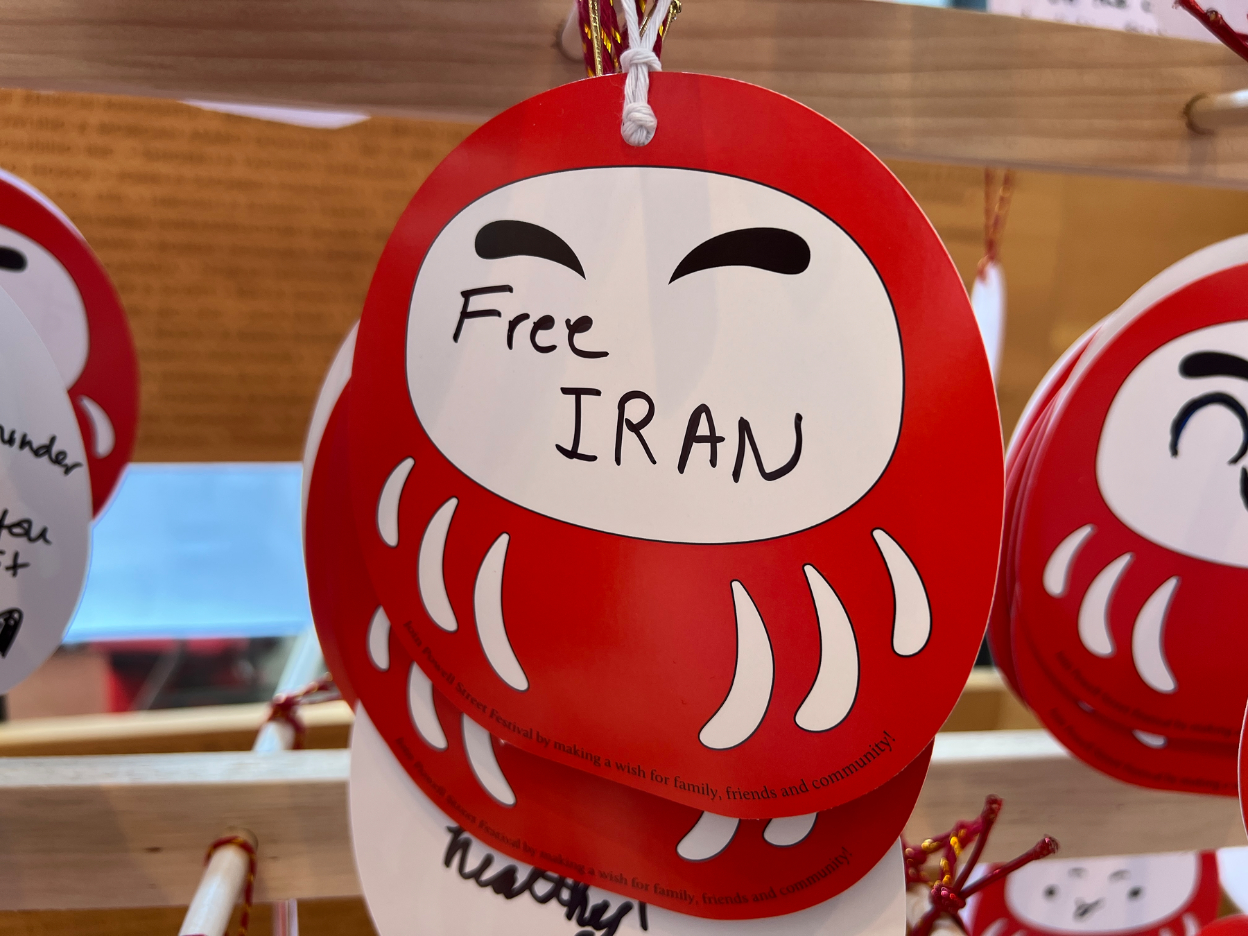 Daruma where people write their wishes. This one says simply: Free IRAN