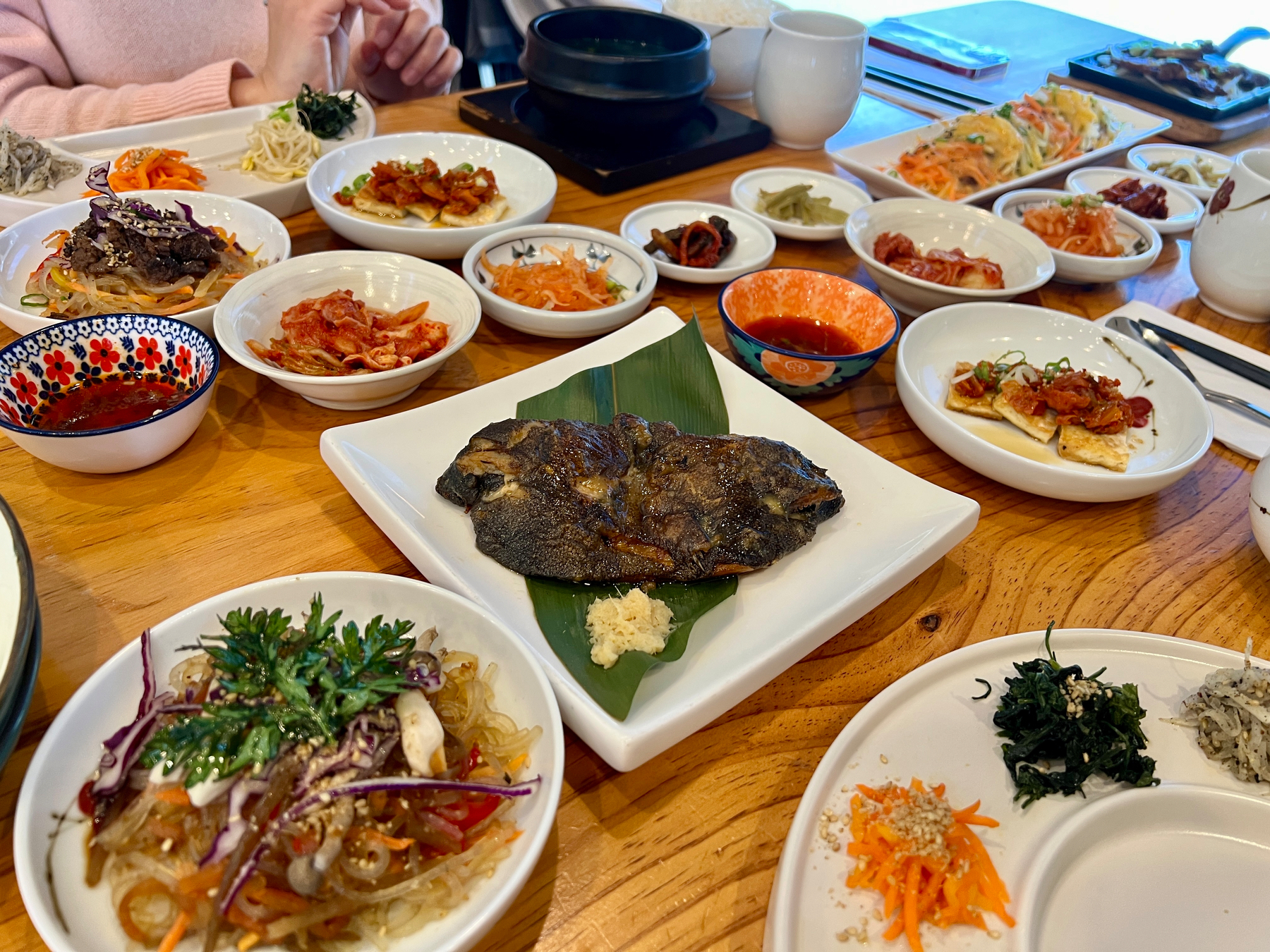 A table FULL of Korean food… even tho only 2 people are eating 